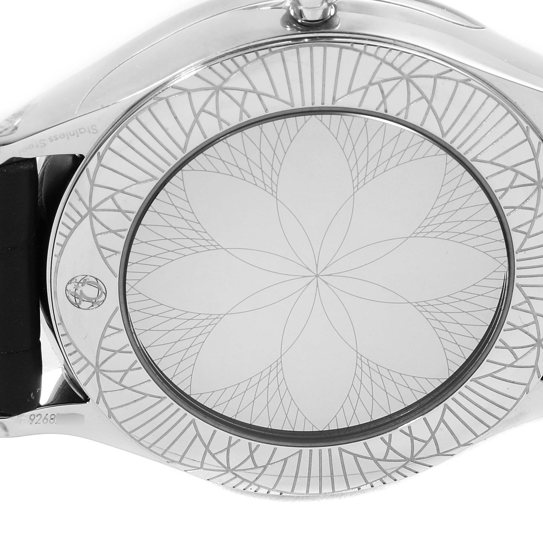 The image shows the back case of the Omega 428.18.36.60.03.001 Women's Stainless Steel Blue Dial 428.18.36.60.03.001 Women's Stainless Steel Blue Dial De Ville Tresor Blue Dial Diamond Steel Ladies Watch 428.18.36.60.03.001, featuring an intricate engraved pattern.