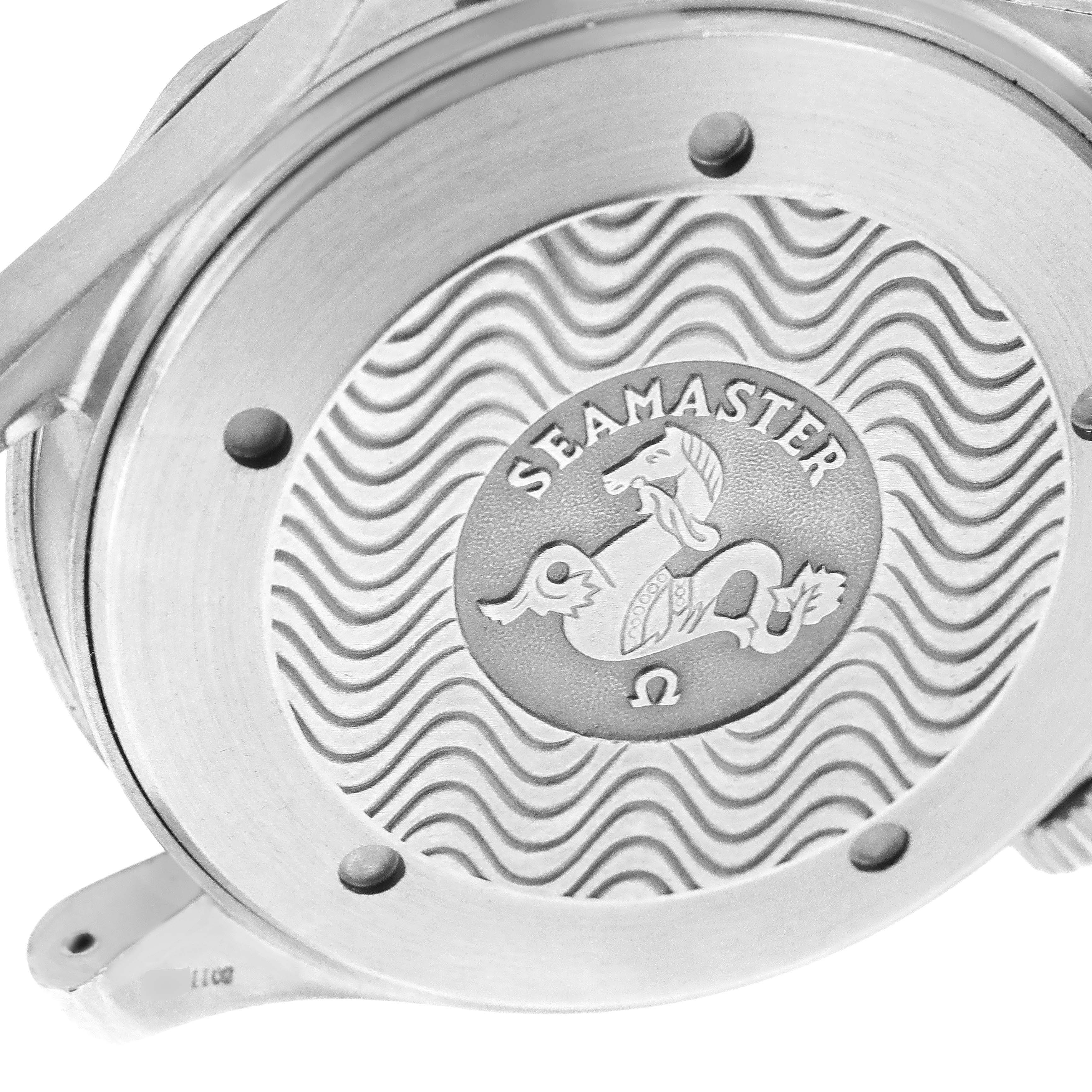 The image shows the case back of an Omega Seamaster 2231.50.00 Men's Titanium Black Dial 2231.50.00 Men's Titanium Black Dial watch, highlighting its engraved logo and wave pattern design.