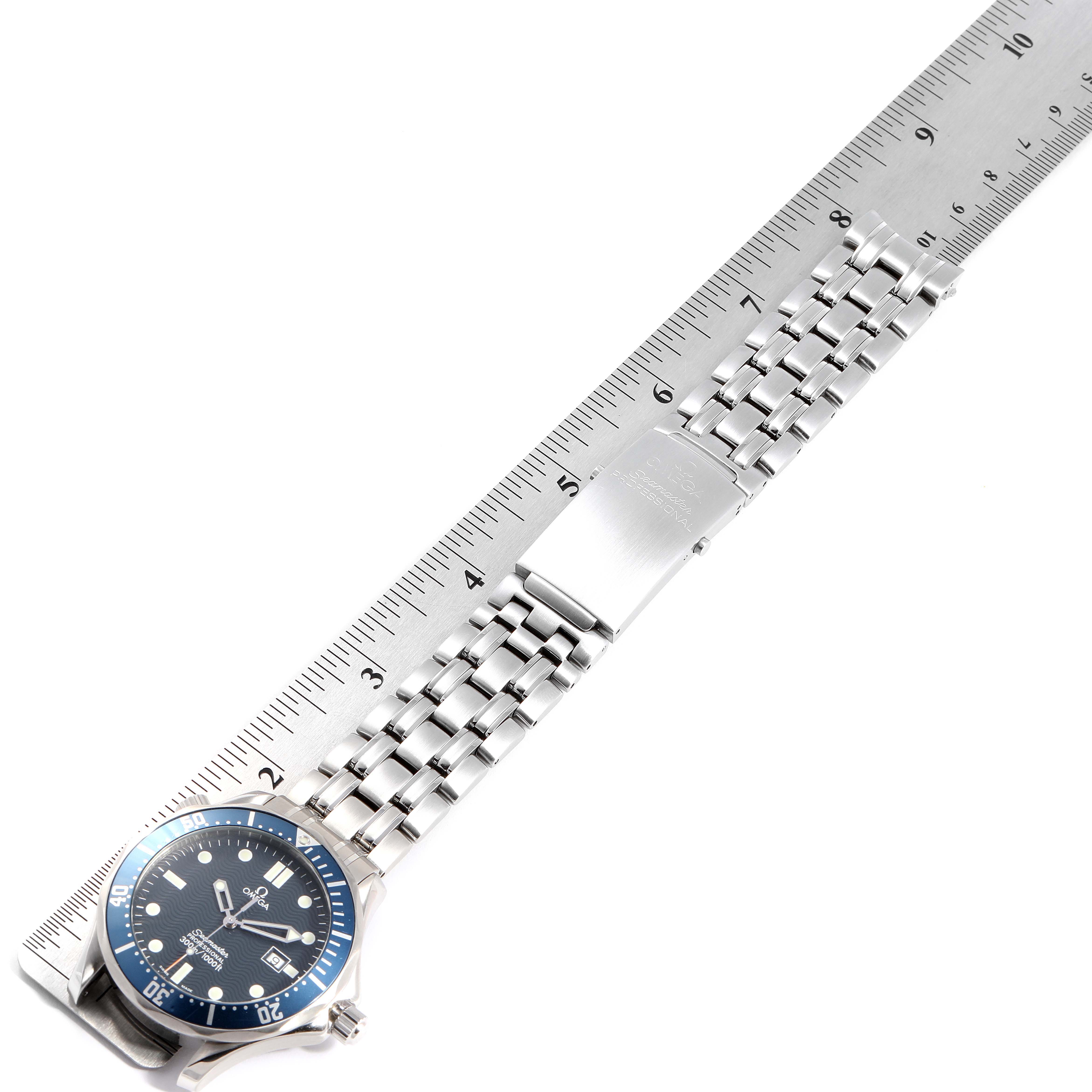 This image shows the dial and bracelet of the Omega Seamaster 2541.80.00 Men
s Stainless Steel Blue Dial 2541.80.00 Men
s Stainless Steel Blue Dial watch, laid flat alongside a ruler.