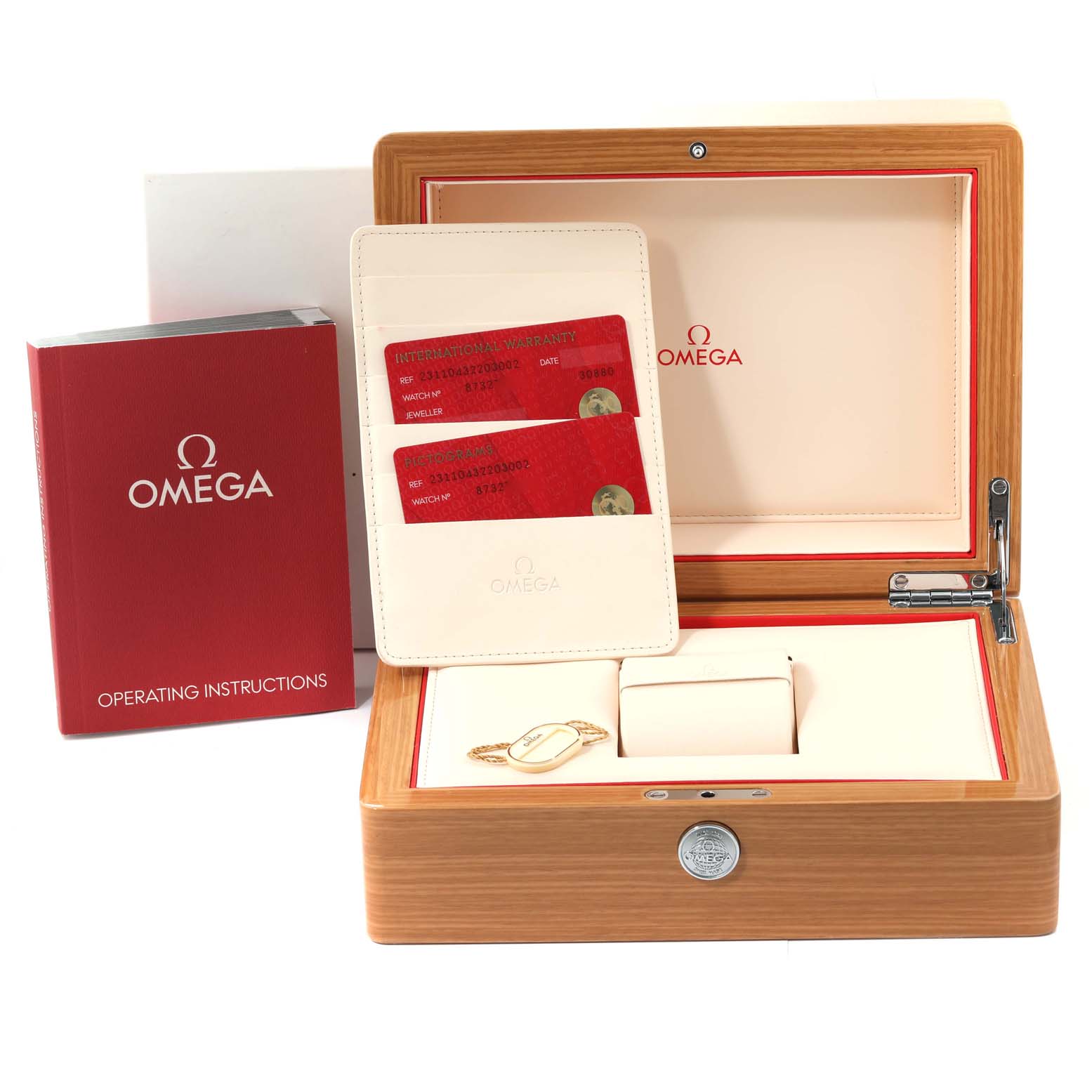 The image shows an Omega Aqua Terra 231.10.43.22.03.002 Men
s Stainless Steel Blue Dial 231.10.43.22.03.002 Men
s Stainless Steel Blue Dial watch box, warranty cards, and an operating instructions manual at an angle, revealing the interior and accessories.