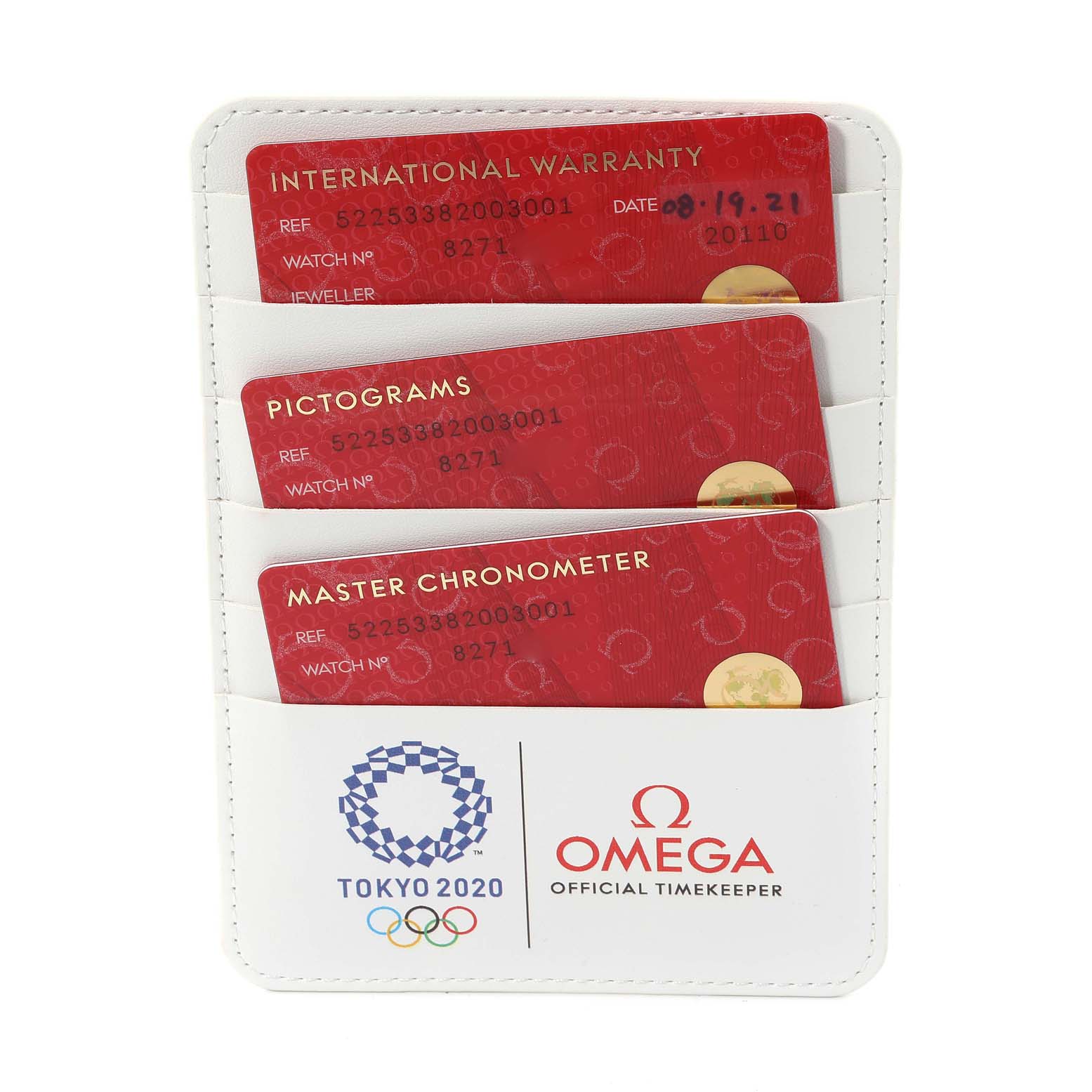 The image shows Omega Aqua Terra 522.53.38.20.03.001 Men's Yellow Gold Blue Dial model cards: International Warranty, Pictograms, and Master Chronometer in a branded holder.
