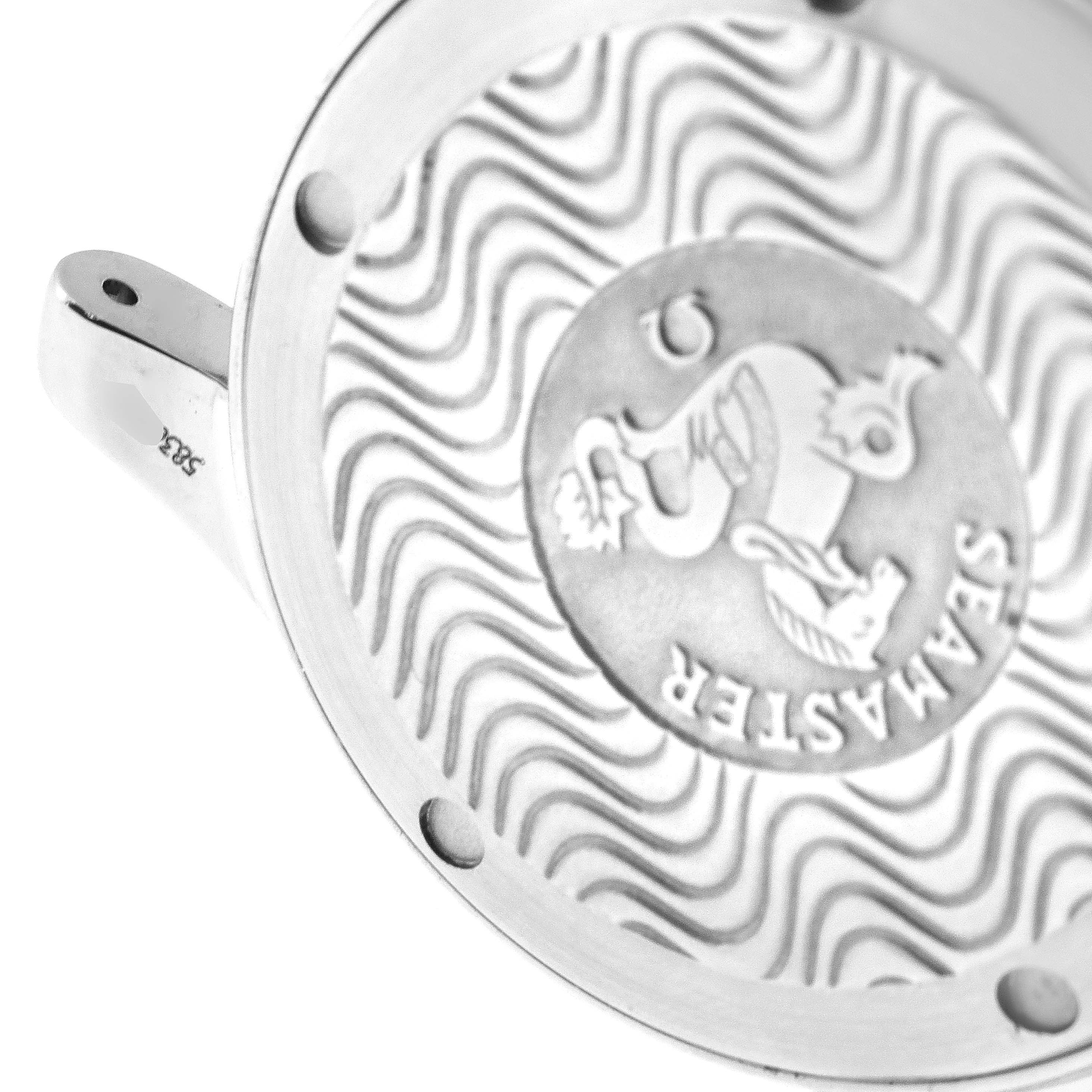 The image shows a close-up of the case back of an Omega Seamaster 2561.80.00 Men
s Stainless Steel Blue Dial 2561.80.00 Men
s Stainless Steel Blue Dial watch, featuring its signature wavy design and emblem.