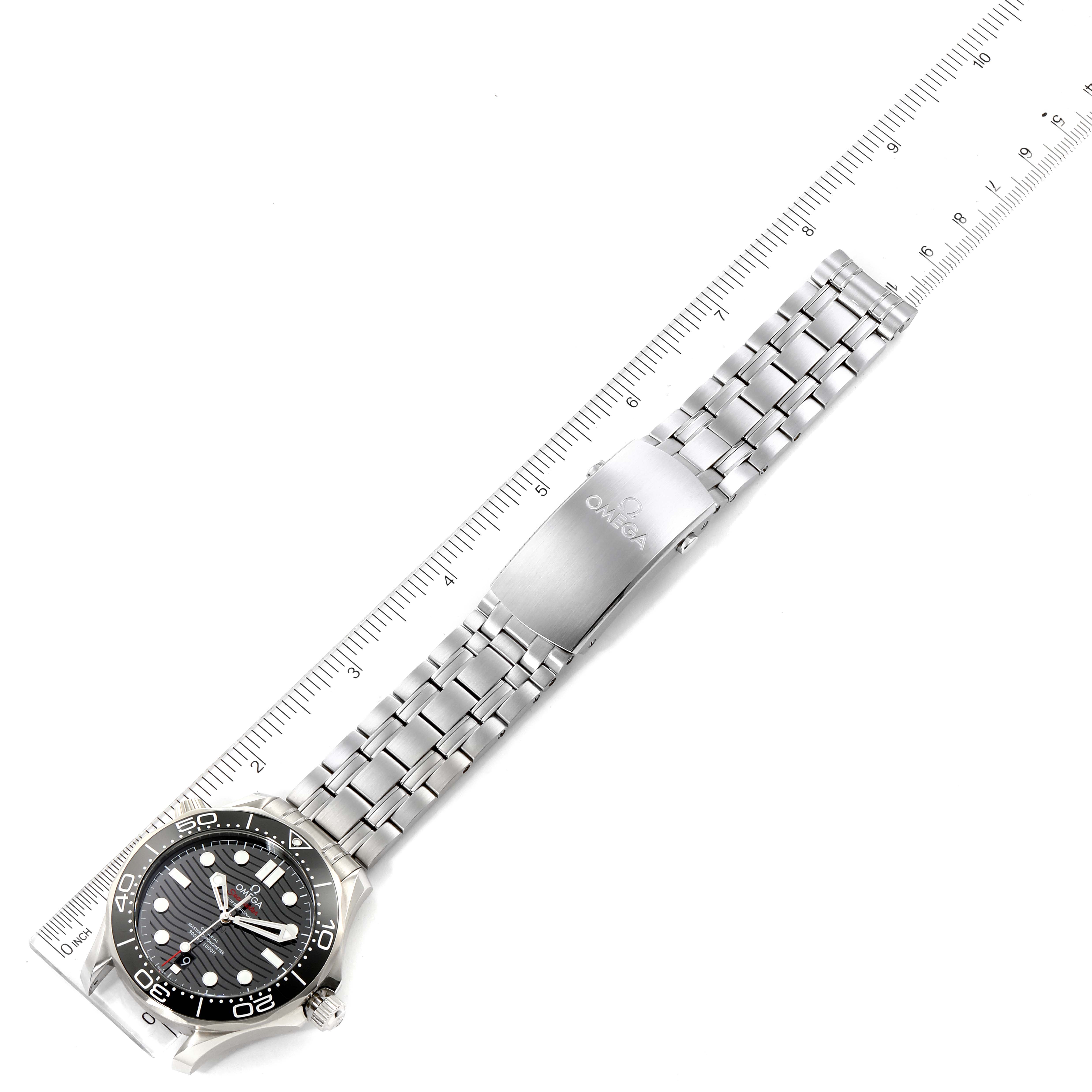The image shows an Omega Seamaster 210.30.42.20.01.001 Men's Stainless Steel Black Dial 210.30.42.20.01.001 Men's Stainless Steel Black Dial watch with a stainless steel bracelet and clasp, positioned next to a ruler for scale.