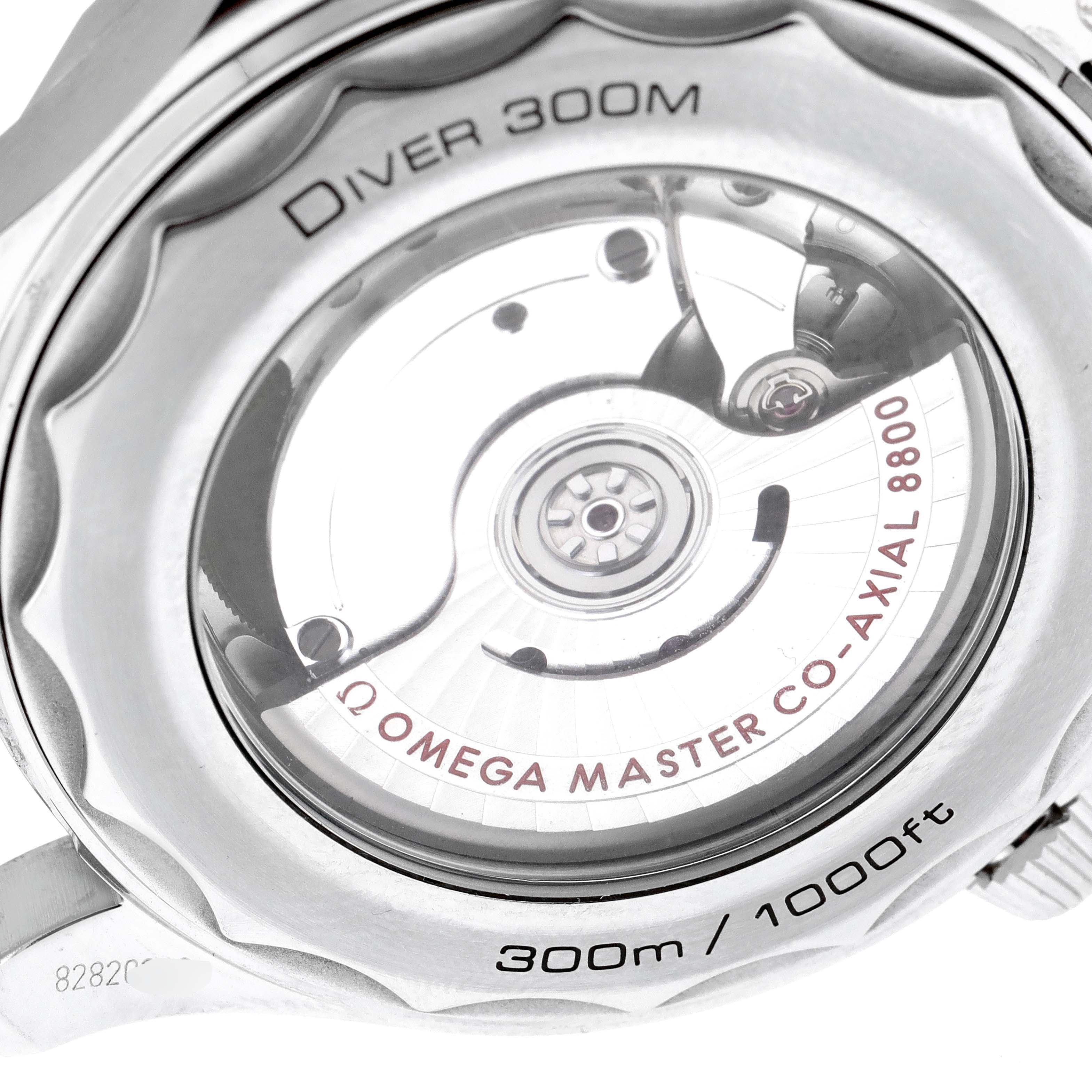 The image shows the back of an Omega Seamaster 210.30.42.20.01.001 Men's Stainless Steel Black Dial 210.30.42.20.01.001 Men's Stainless Steel Black Dial Diver 300M, highlighting the Co-Axial 8800 movement through a transparent case back.