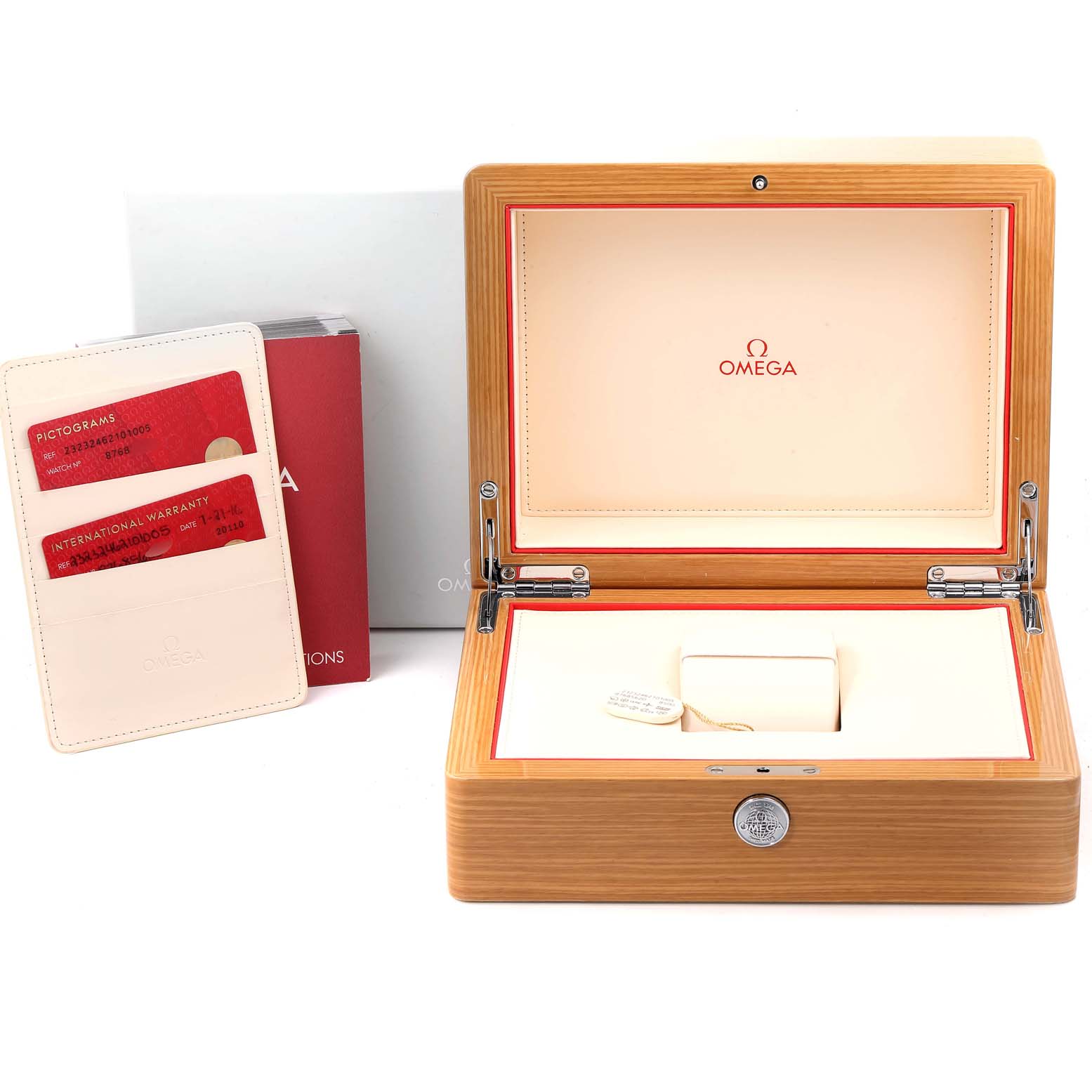 The image shows an open wooden Omega watch box and accompanying documents for the Seamaster model.
