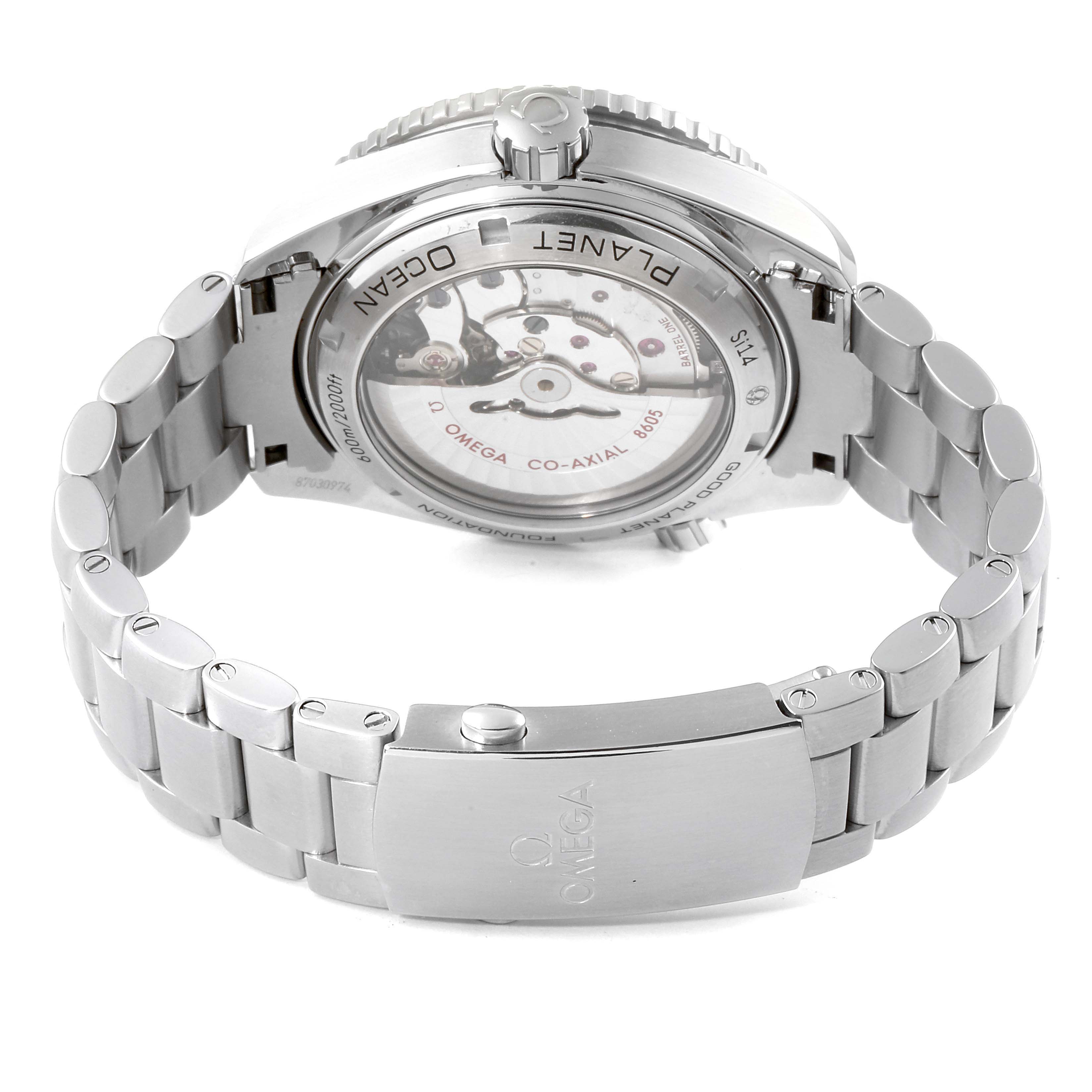 The image depicts the back view of an Omega Seamaster 232.30.44.22.03.001 Men
s Stainless Steel Blue Dial 232.30.44.22.03.001 Men
s Stainless Steel Blue Dial watch, showing the movement and the stainless steel bracelet clasp.