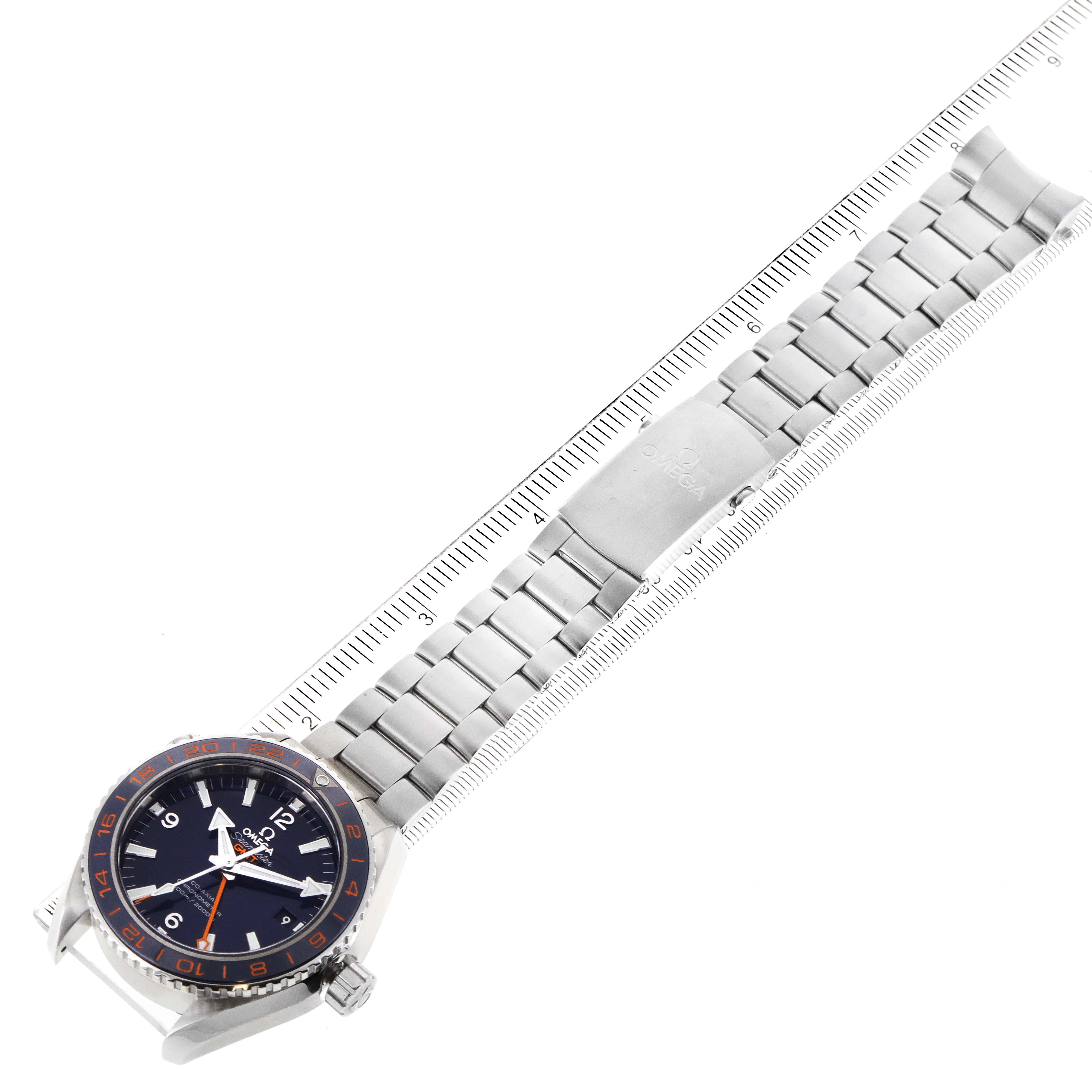 This Omega Seamaster 232.30.44.22.03.001 Men
s Stainless Steel Blue Dial 232.30.44.22.03.001 Men
s Stainless Steel Blue Dial watch is shown at an angle displaying its face, bezel, and full metal bracelet alongside a ruler.