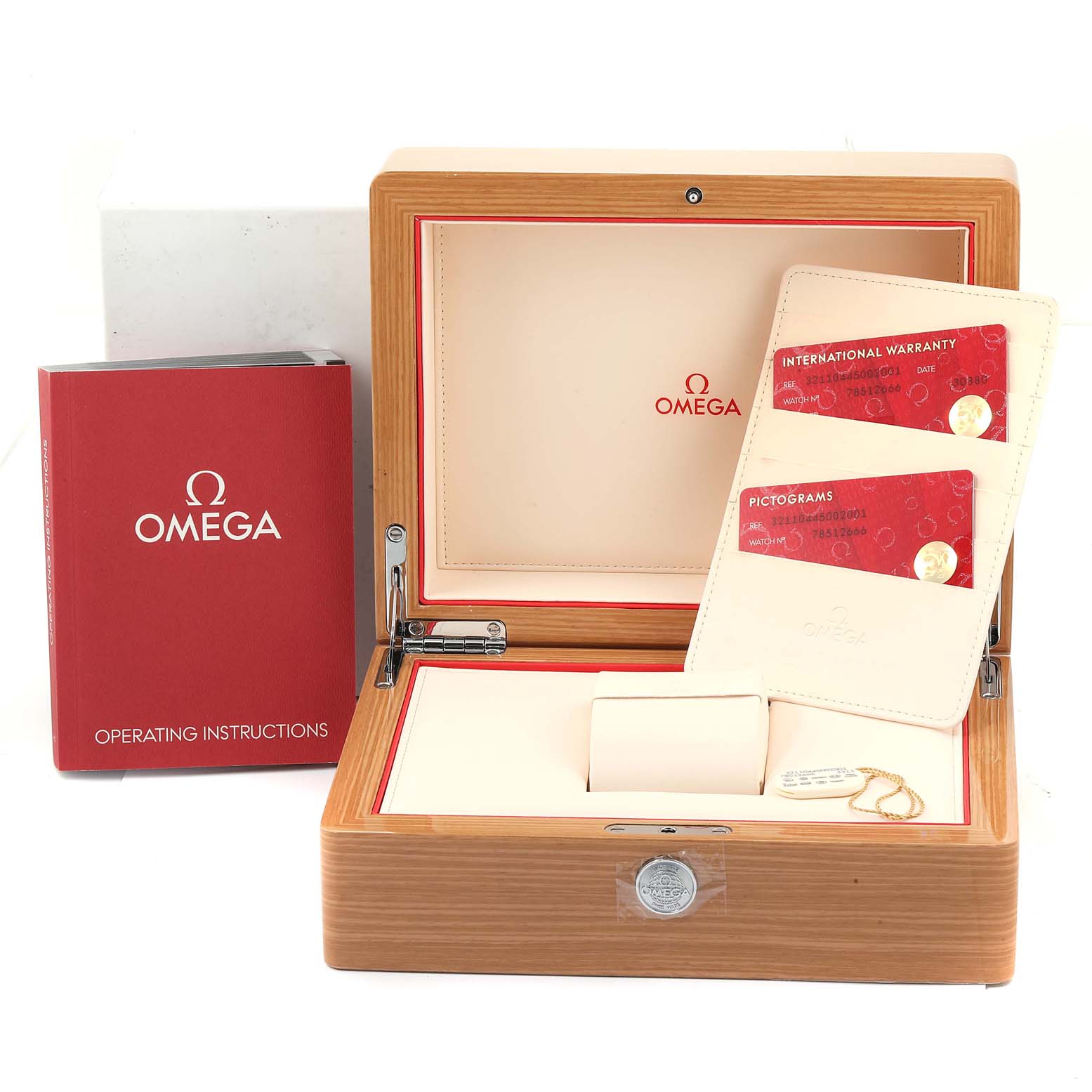 The image shows the opened packaging box, warranty cards, and operating instructions for the Omega Speedmaster 321.10.44.50.02.001 Men's Stainless Steel Silver Dial 321.10.44.50.02.001 Men's Stainless Steel Silver Dial.