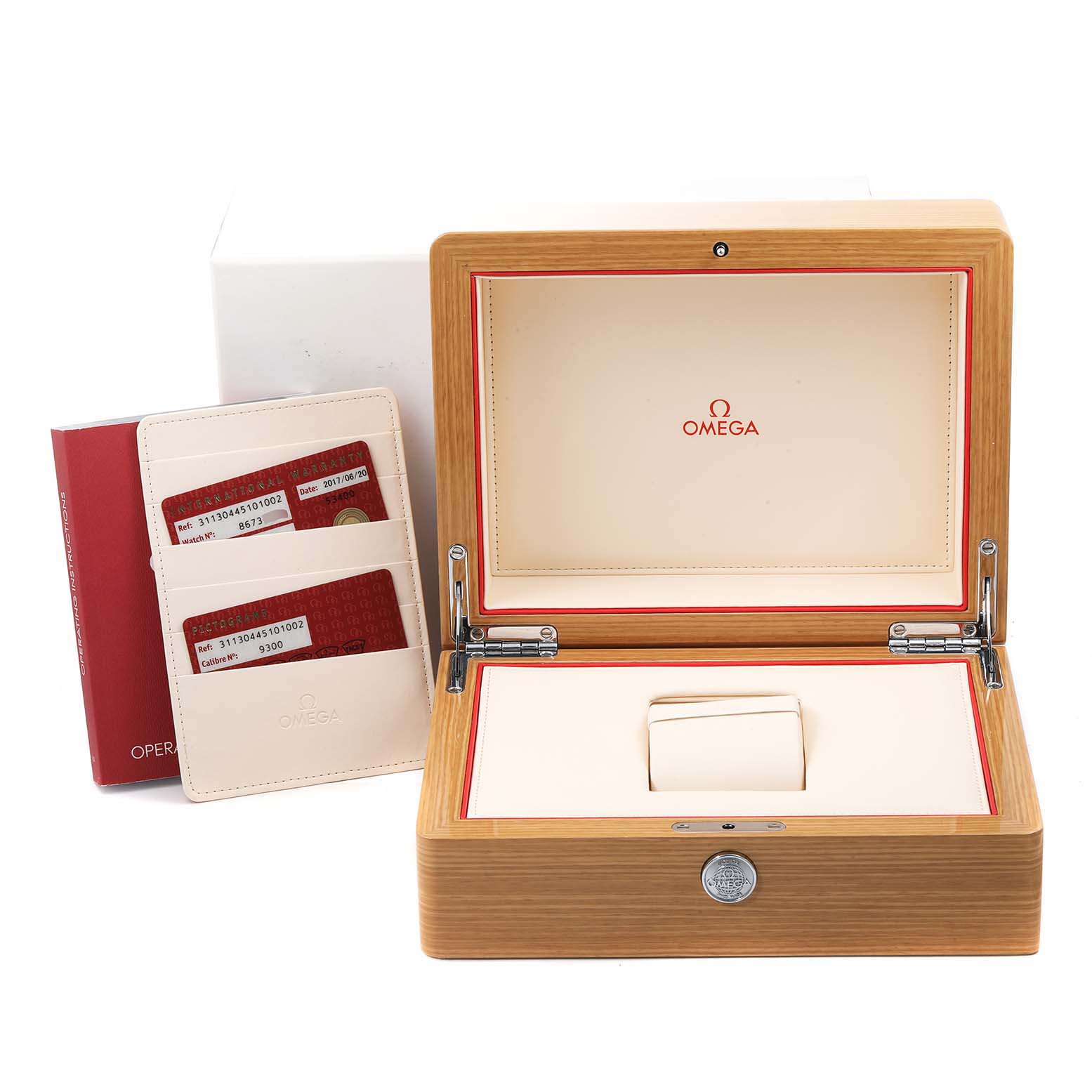 This image shows an Omega Speedmaster 311.30.44.51.01.002 Men
s Stainless Steel Black Dial 311.30.44.51.01.002 Men
s Stainless Steel Black Dial watch box, warranty cards in a holder, and an operation manual.