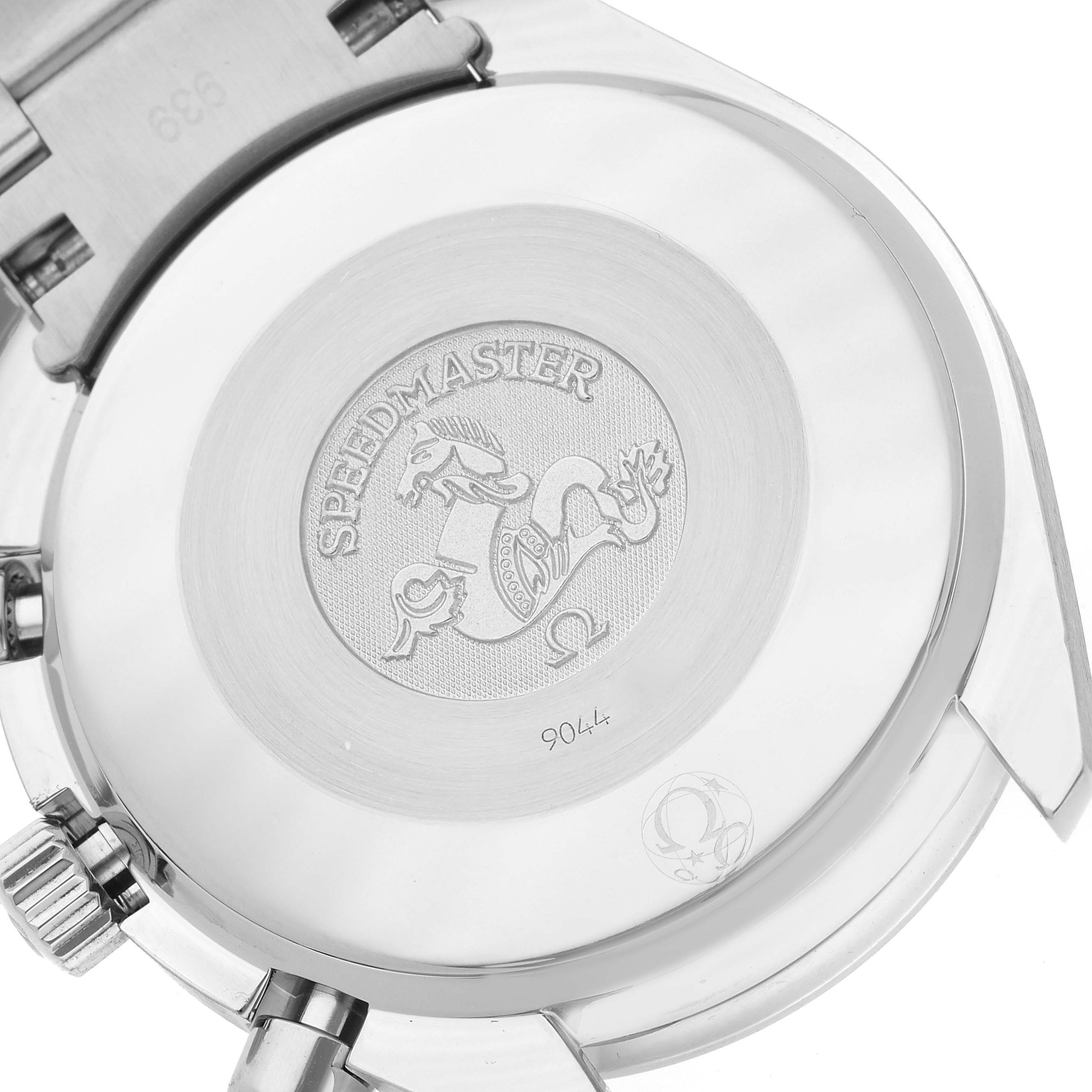 The image shows the back case of an Omega Speedmaster 3534.74.00 Men's Stainless Steel Mother of Pearl Dial 3534.74.00 Men's Stainless Steel Mother of Pearl Dial watch at a slight angle, highlighting its engraving.