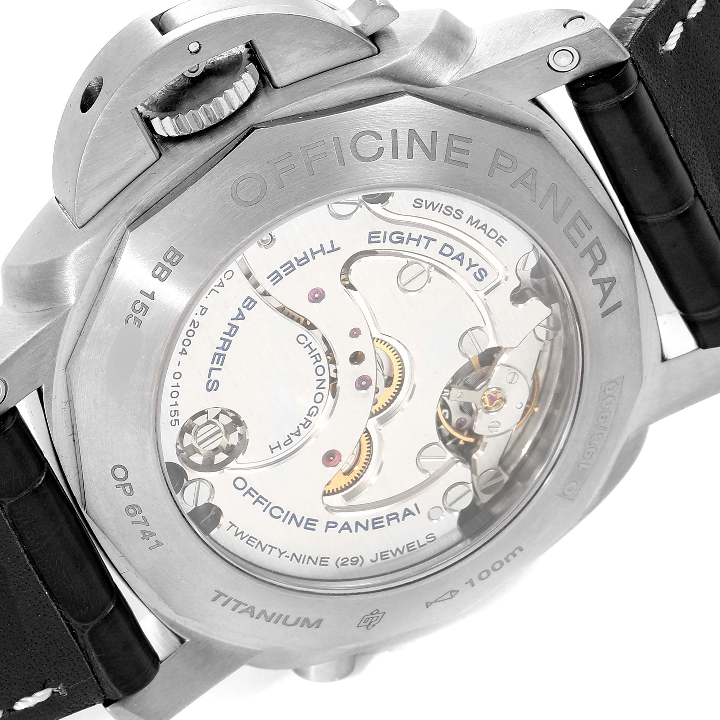 The image shows the back view of a Panerai Luminor PAM00311 Men's Titanium Black Dial PAM00311 Men's Titanium Black Dial watch, displaying its inner mechanisms and branding.