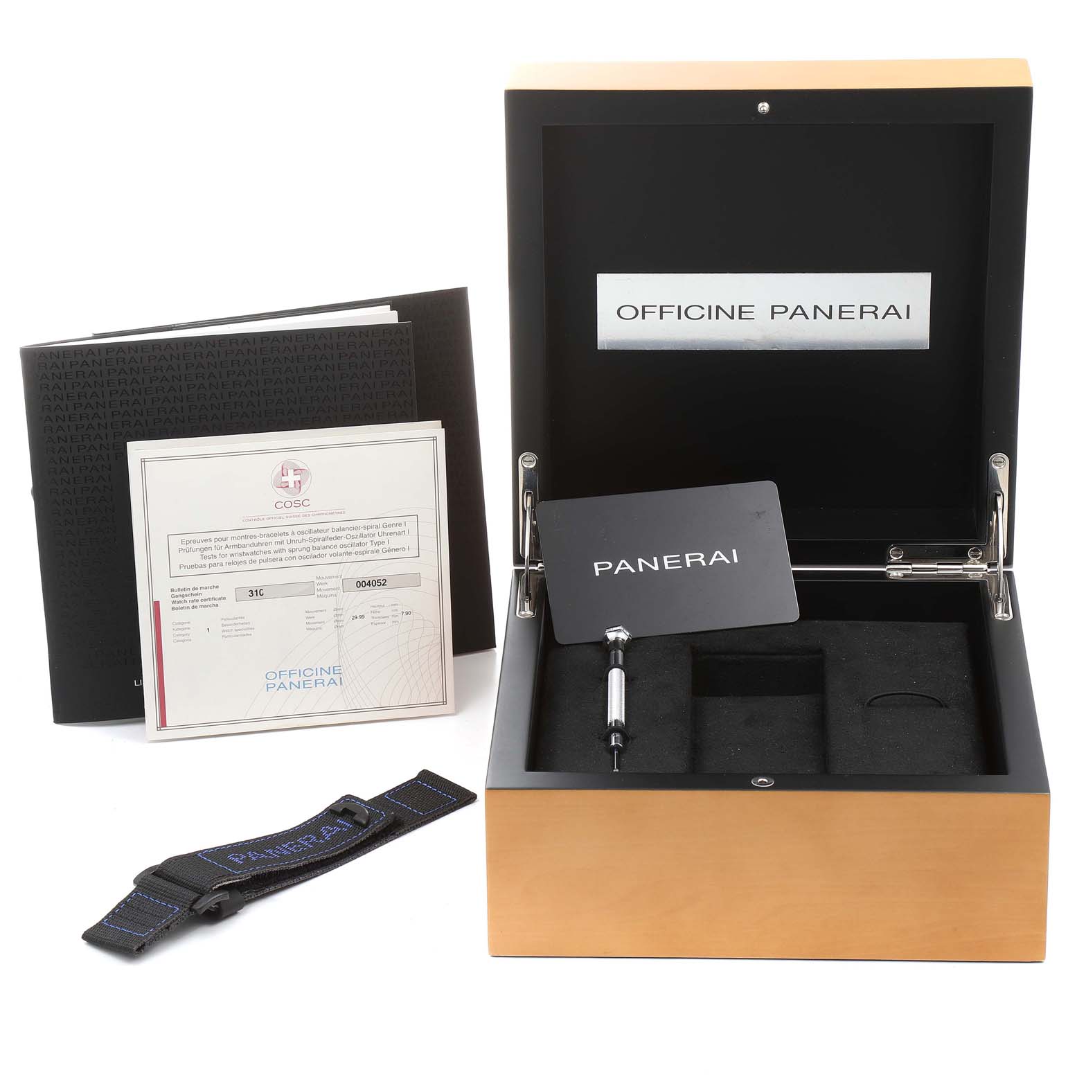 The image shows the box and accessories for a Panerai Submersible PAM01024 Men's Stainless Steel Black Dial PAM01024 Men's Stainless Steel Black Dial model, including manuals, a strap, and a screwdriver, viewed from the top.