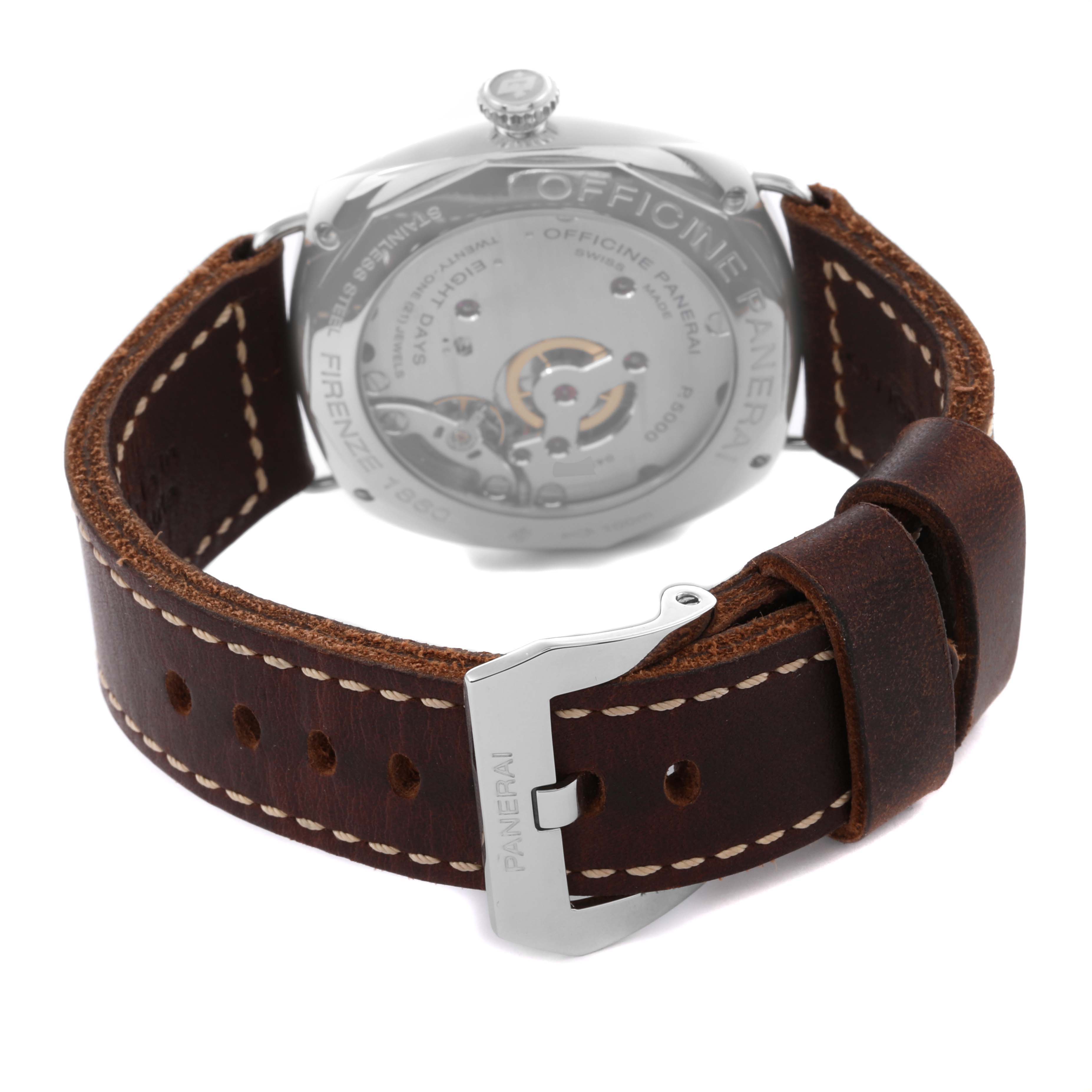 The image shows the back view of a Panerai Radiomir PAM00610 Men's Stainless Steel Black Dial watch displaying the movement and brown leather strap with buckle.