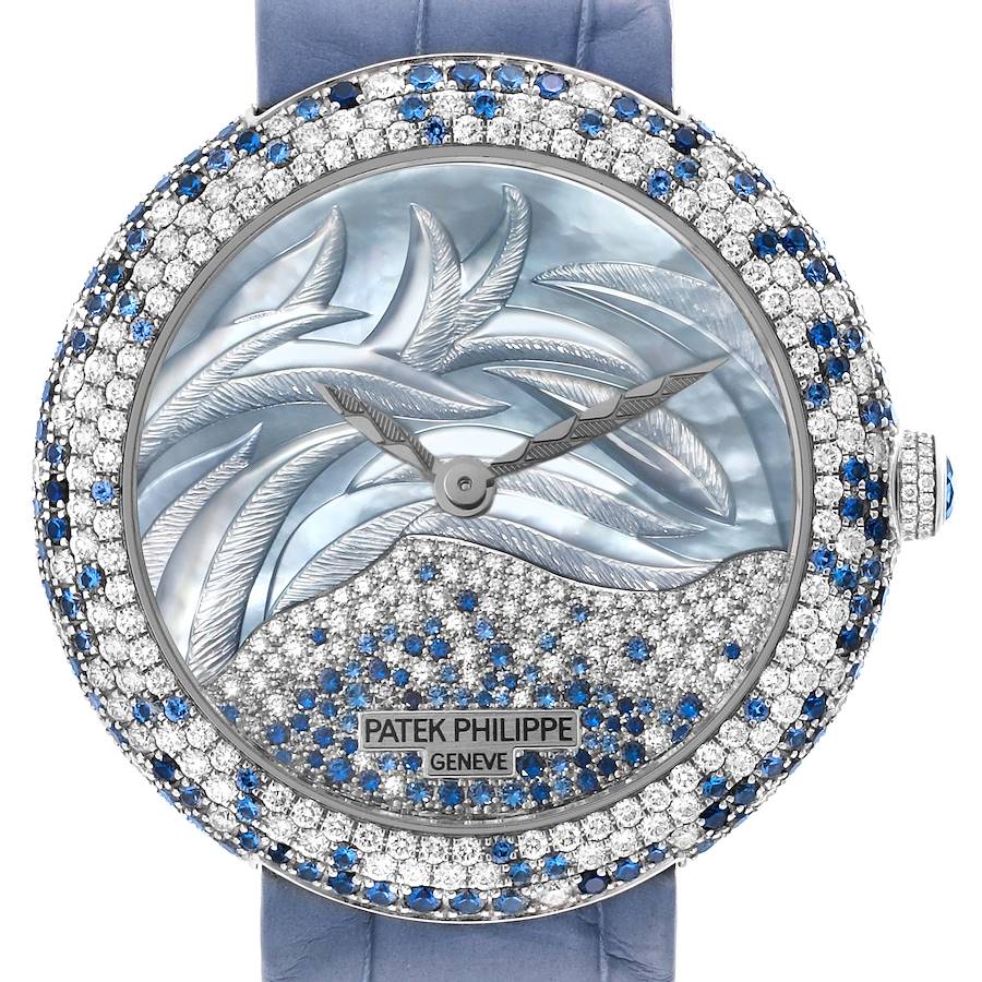 The Patek Philippe Calatrava watch is shown from the front, highlighting its intricate dial and gemstone-studded bezel.
