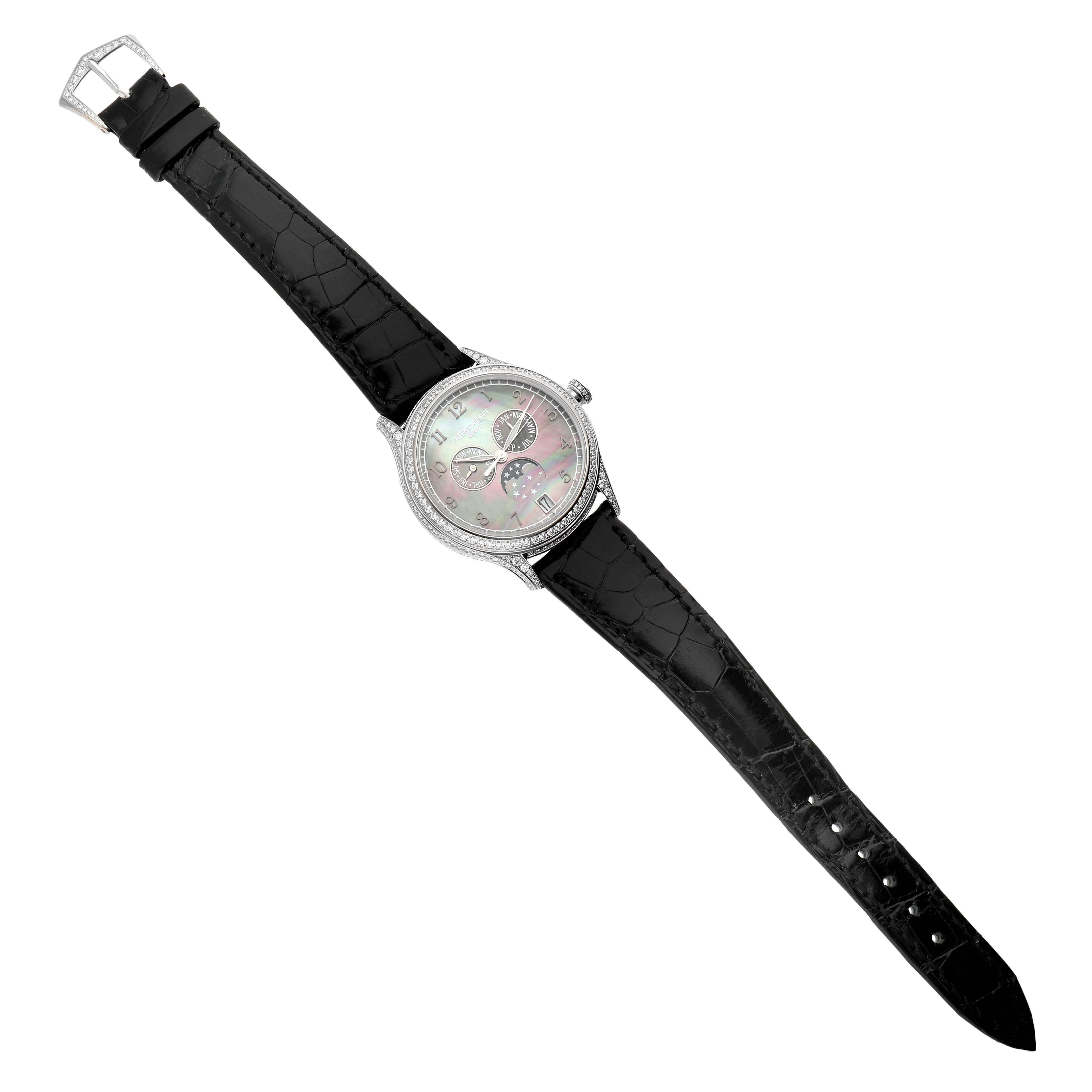 This image shows a top-down view of a Patek Philippe Complications 4948G Men's White Gold Mother of Pearl Dial watch, highlighting its dial, bezel, and black leather strap.