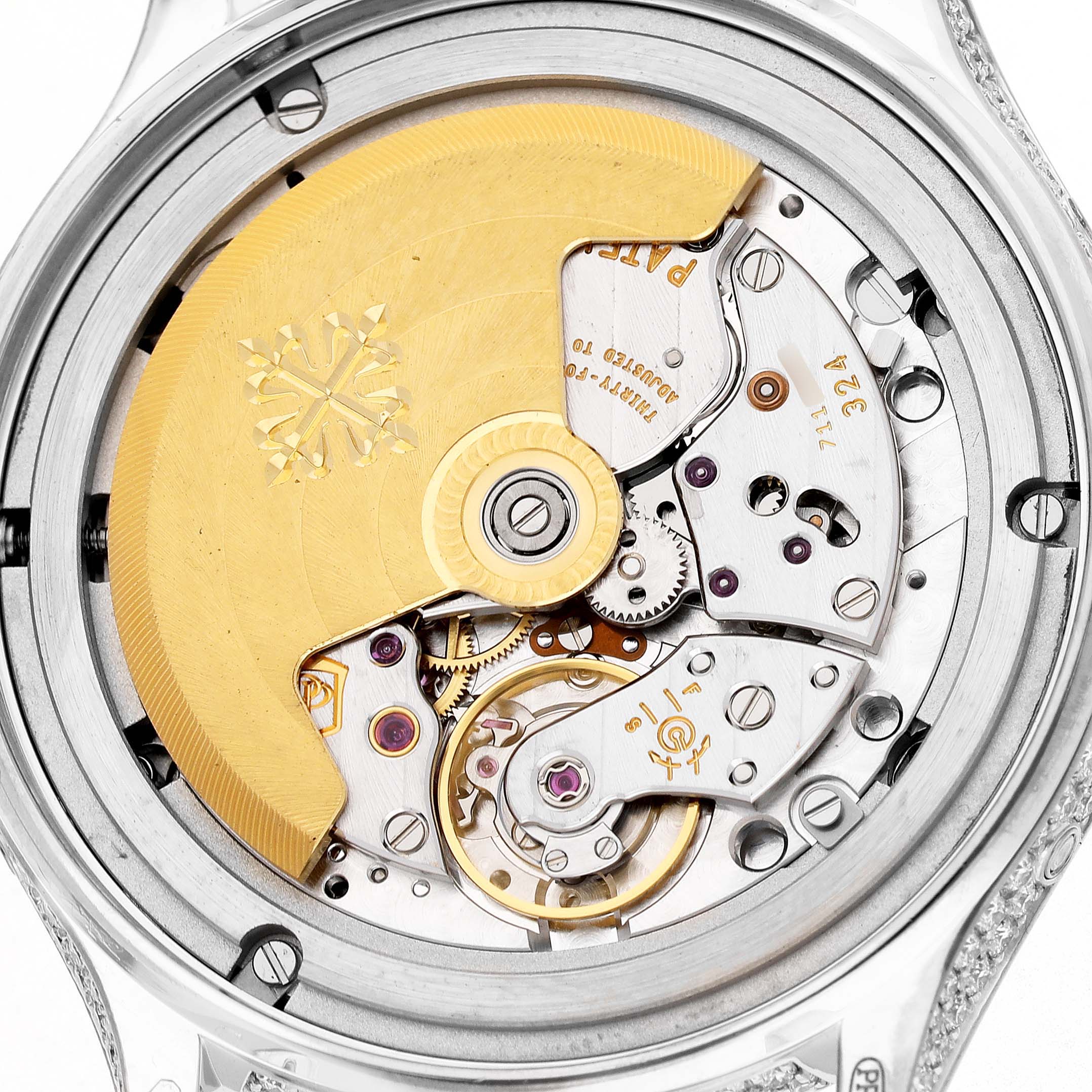 The image shows the back view of the Patek Philippe Complications 4948G Men's White Gold Mother of Pearl Dial watch, featuring its intricate automatic movement and rotor.