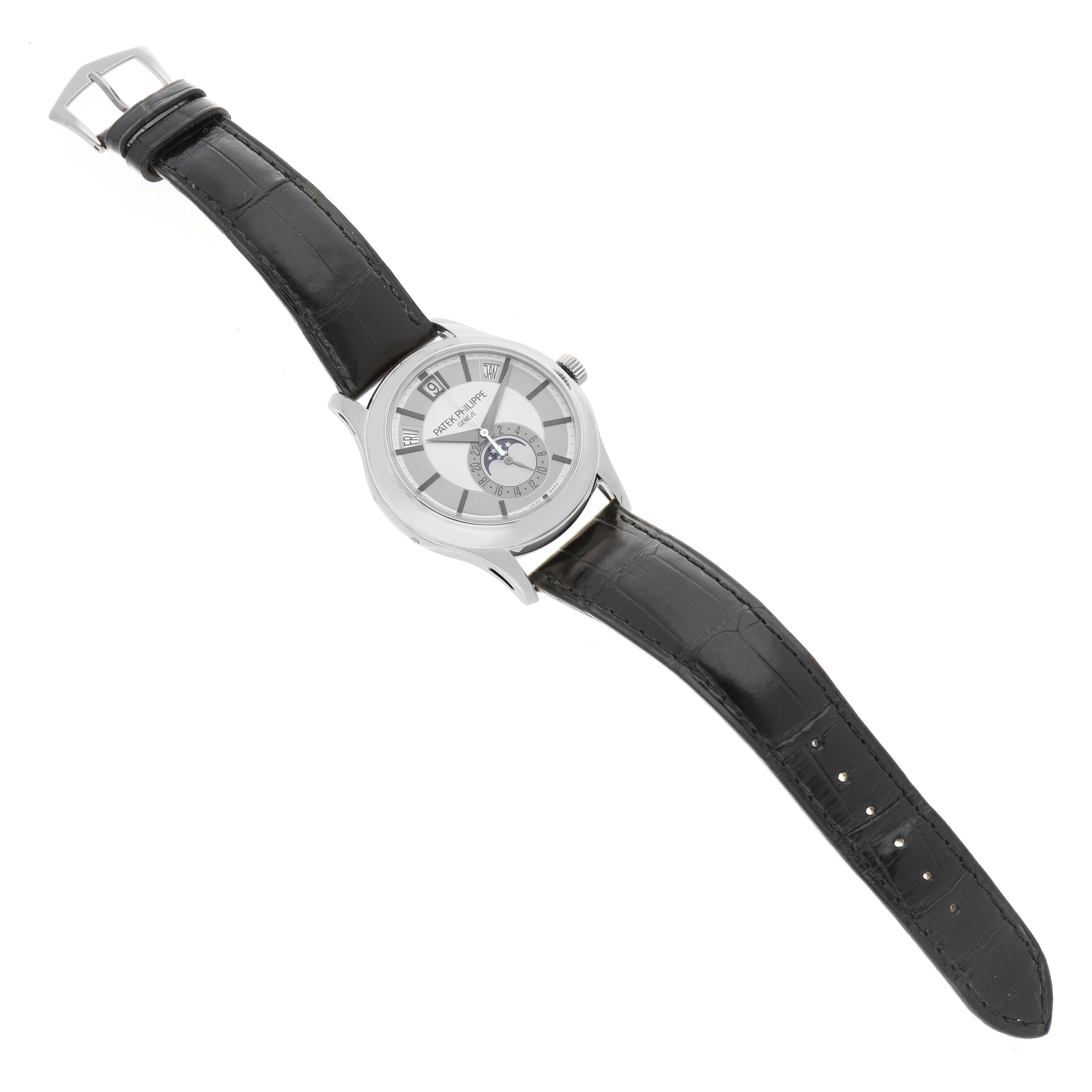 The Patek Philippe Complications 5205G Men's White Gold Silver Dial watch is shown from an angled top view, displaying the face, case, and full leather strap.