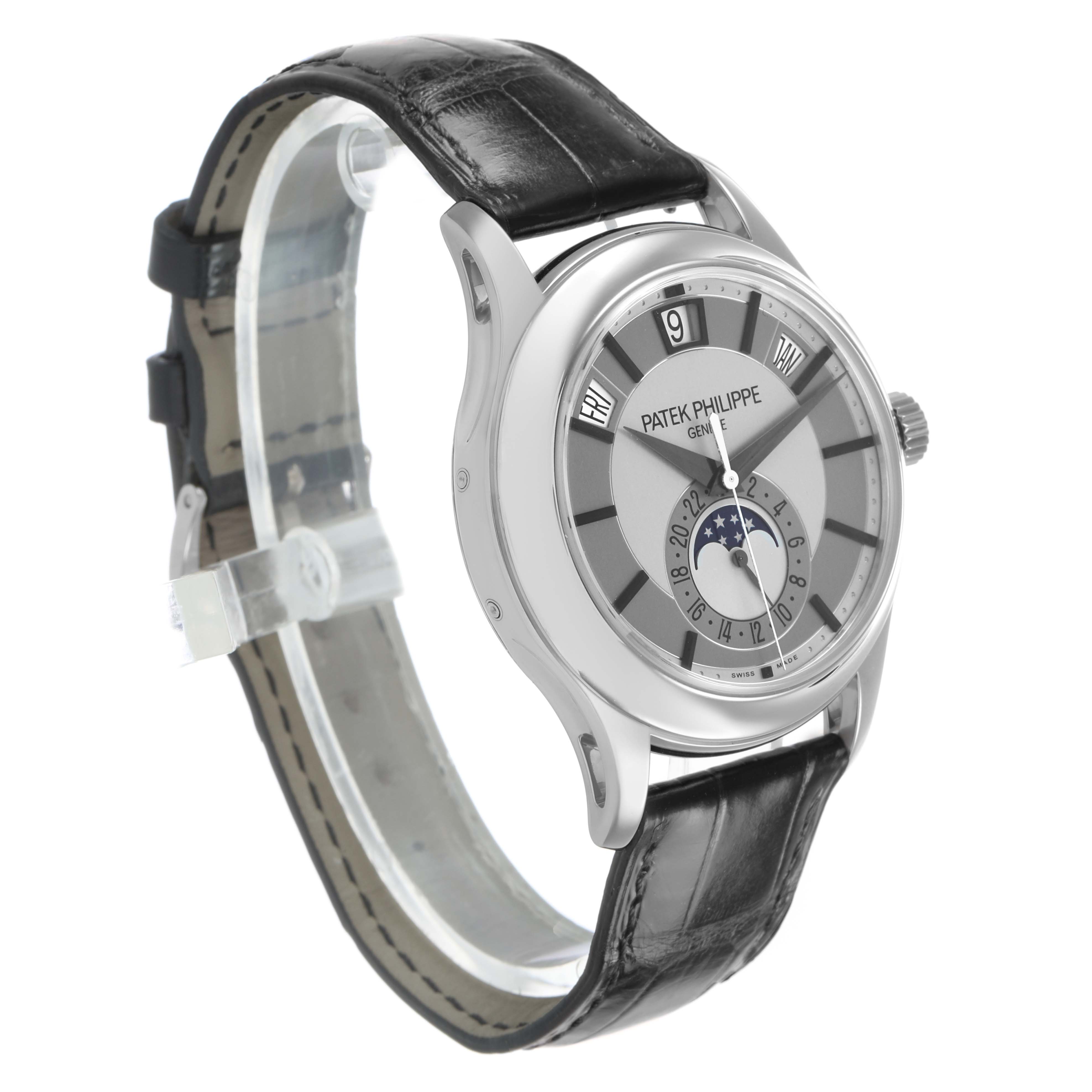 The Patek Philippe Complications 5205G Men's White Gold Silver Dial watch is shown at a three-quarter angle, highlighting the dial, case, and black leather strap.