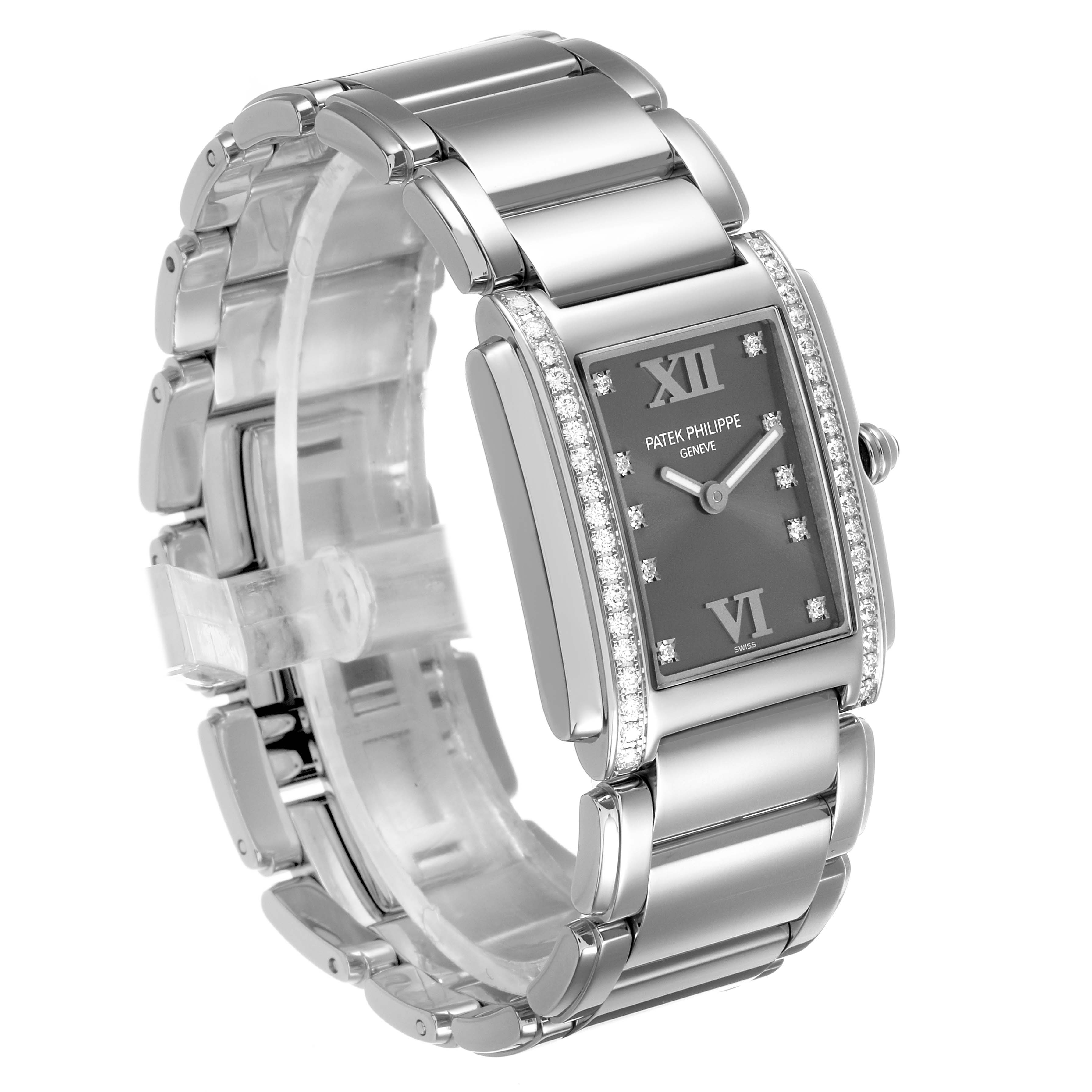 The Patek Philippe Twenty-4 4910/10A-010 Women's Stainless Steel Grey Dial watch is shown at a three-quarter angle, highlighting its rectangular face, diamond-set bezel, and metal bracelet.