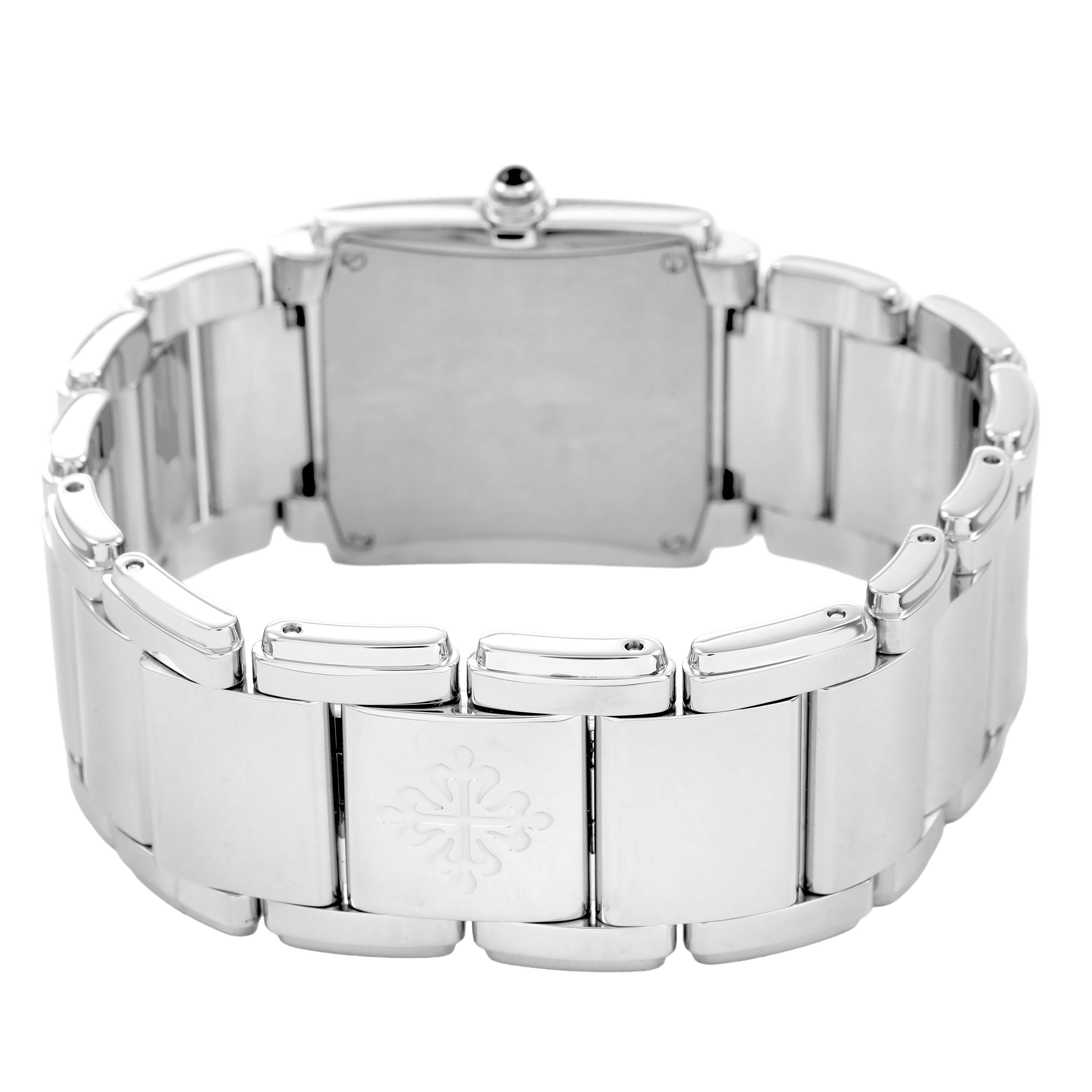 The image shows the back view of a Patek Philippe Twenty-4 4910/10A-010 Women's Stainless Steel Grey Dial watch, highlighting the bracelet and clasp with the brand's emblem.