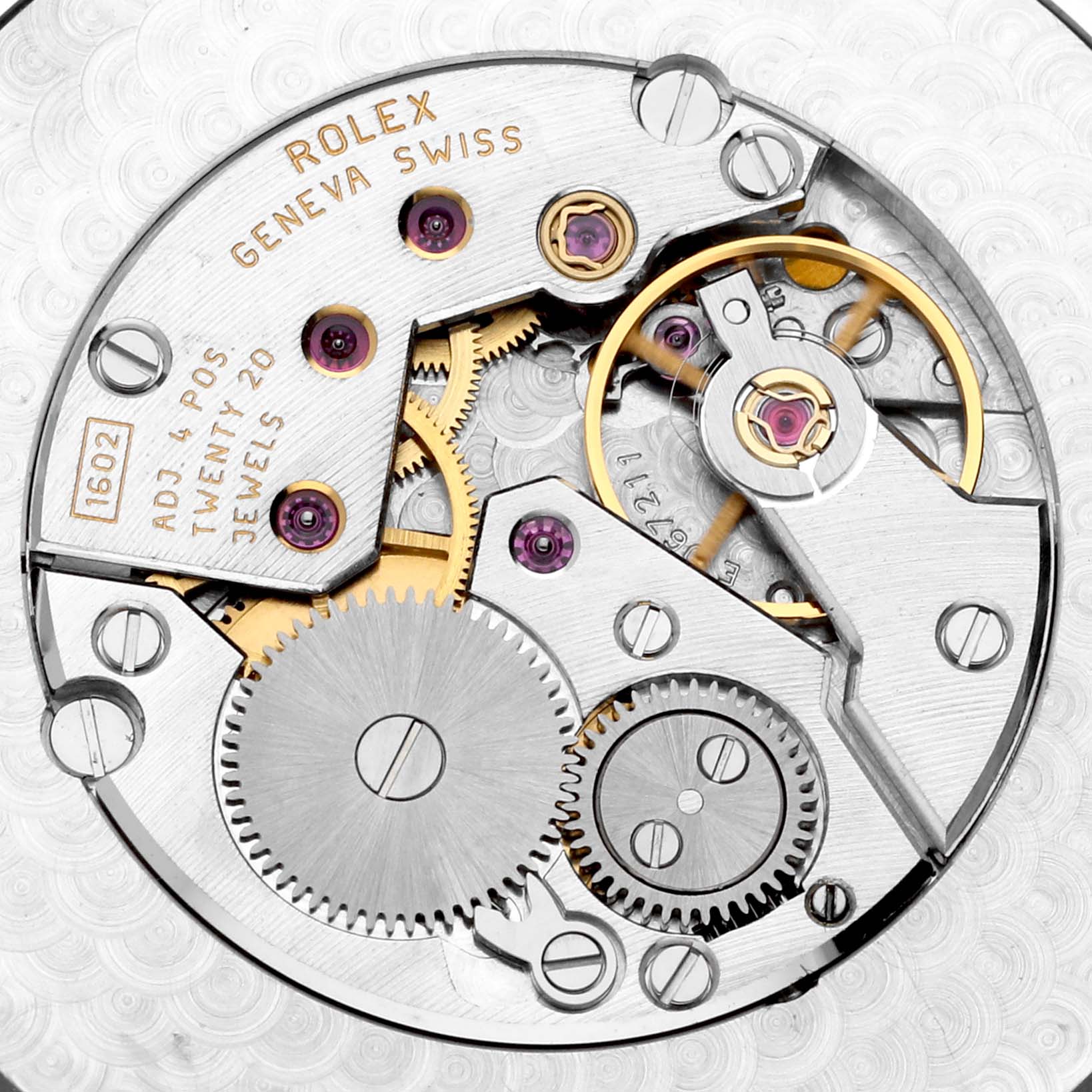 The image shows the intricate internal movement of a Rolex Cellini 4243 Men's White Gold White Dial 4243 Men's White Gold White Dial watch, highlighting gears and jewels from a top-down angle.