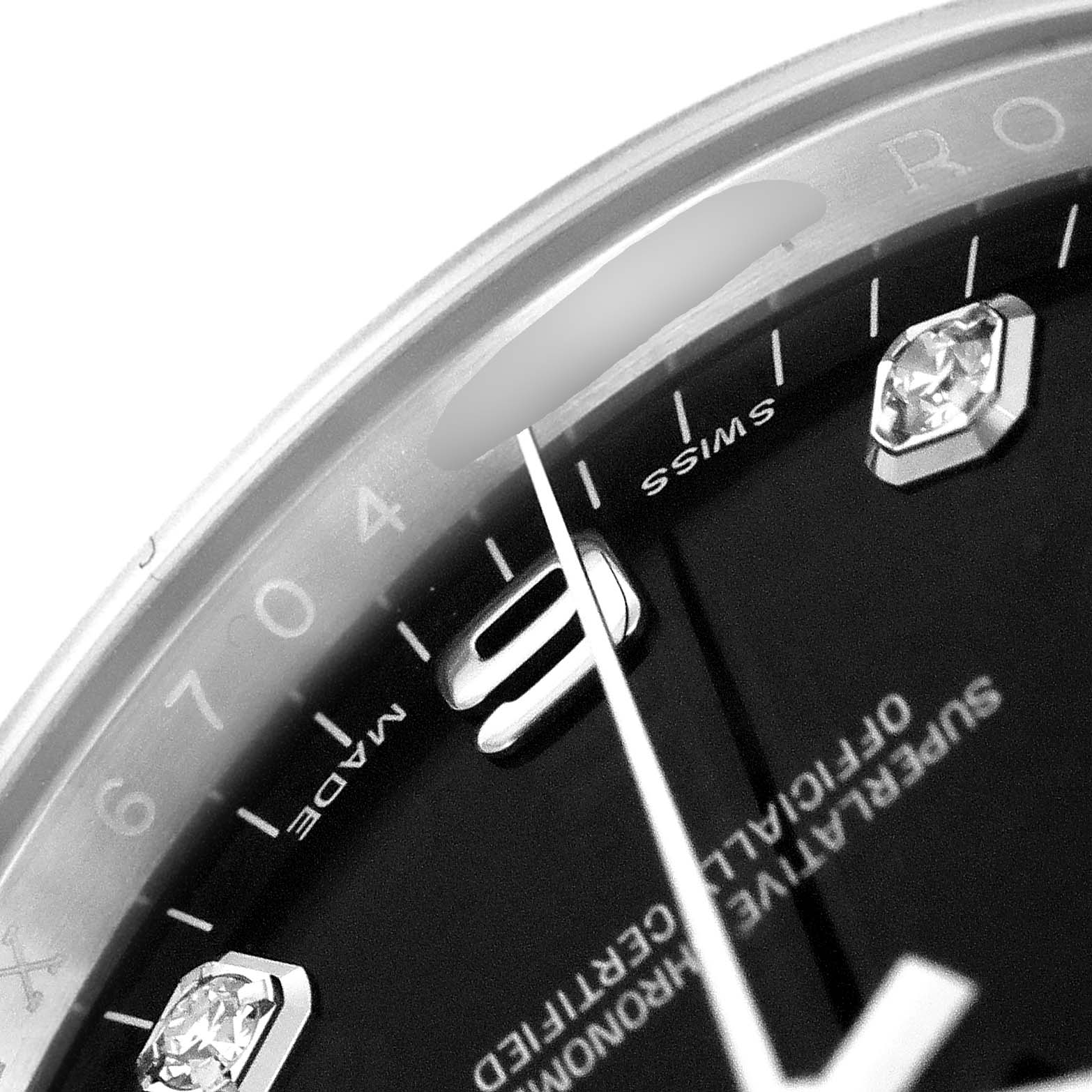 The image shows a close-up of the dial, bezel, and markers of a Rolex Date 115234 Men's Stainless Steel Black Dial 115234 Men's Stainless Steel Black Dial model watch.