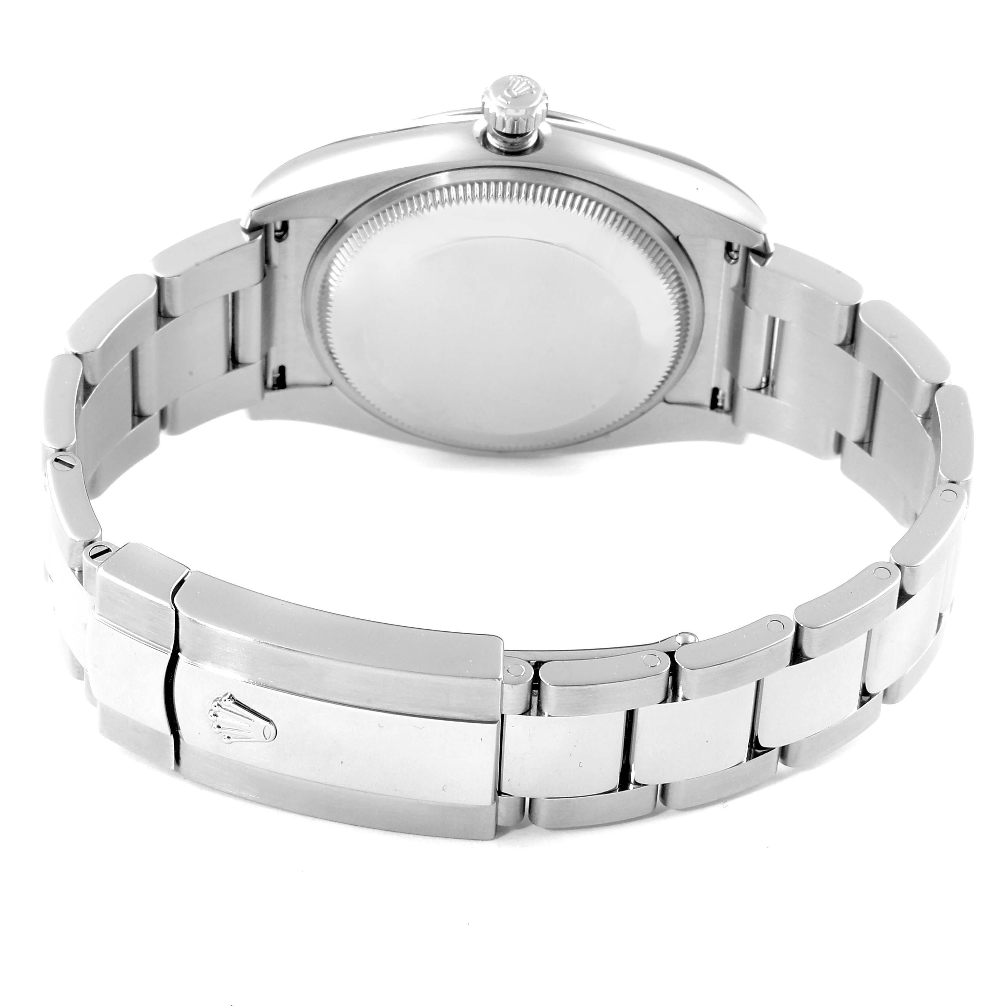 This image shows the bracelet and case back of a Rolex Date 115234 Men's Stainless Steel Black Dial 115234 Men's Stainless Steel Black Dial model watch viewed from the rear.