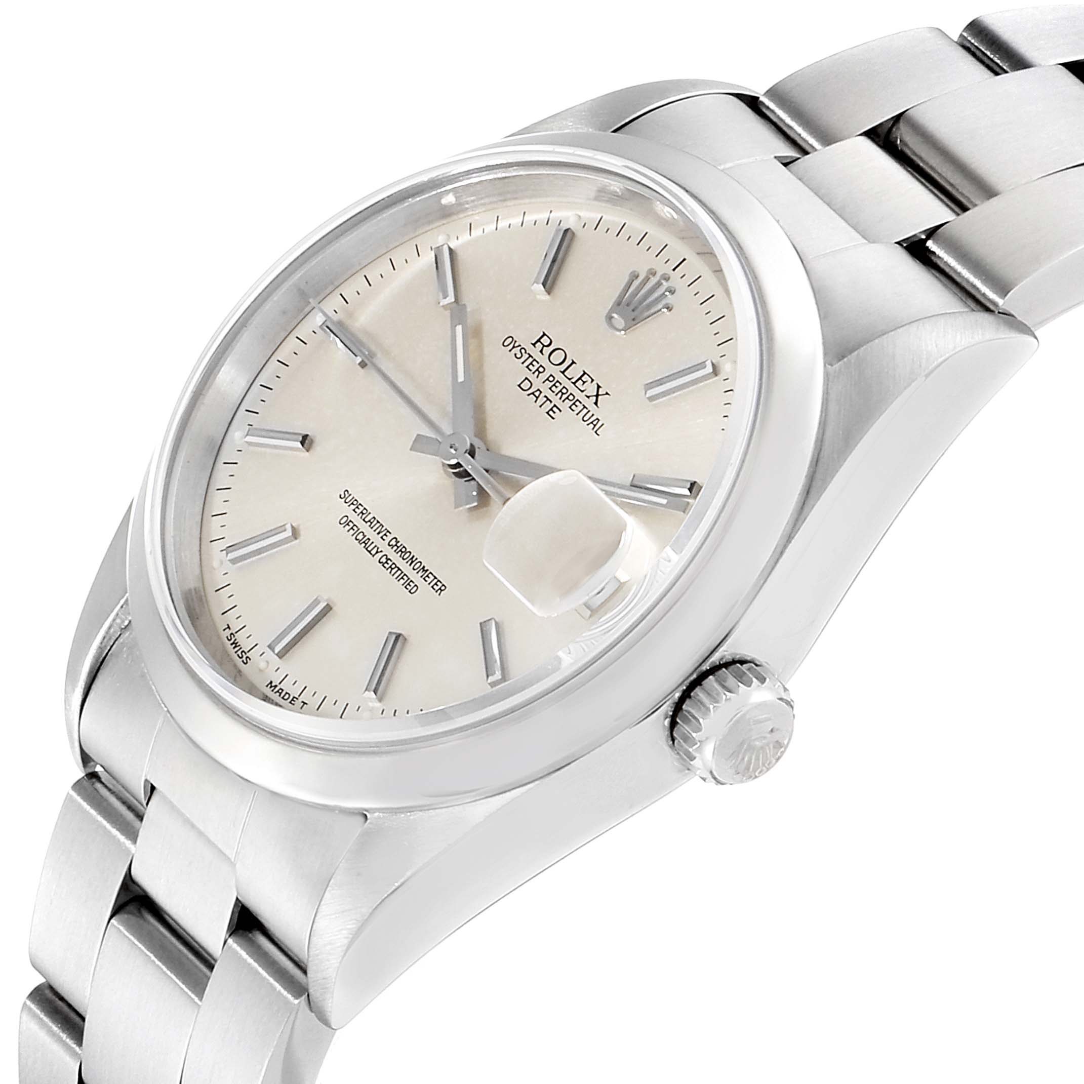 The image shows a close-up, angled view of the Rolex Oyster Perpetual Date model, highlighting the dial, crown, and bracelet.