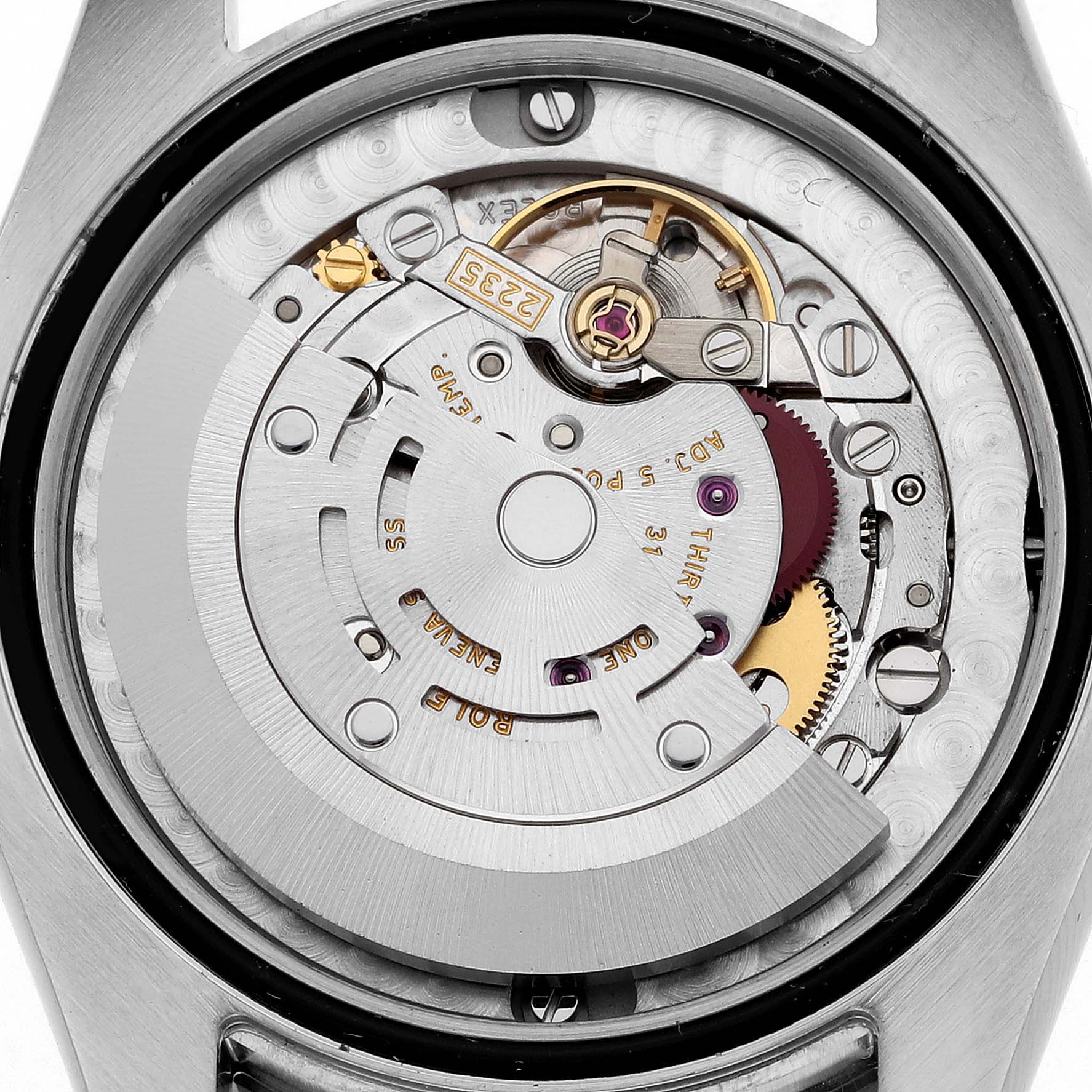 The image shows the inner mechanism of a Mid-Size Rolex watch from a back view.