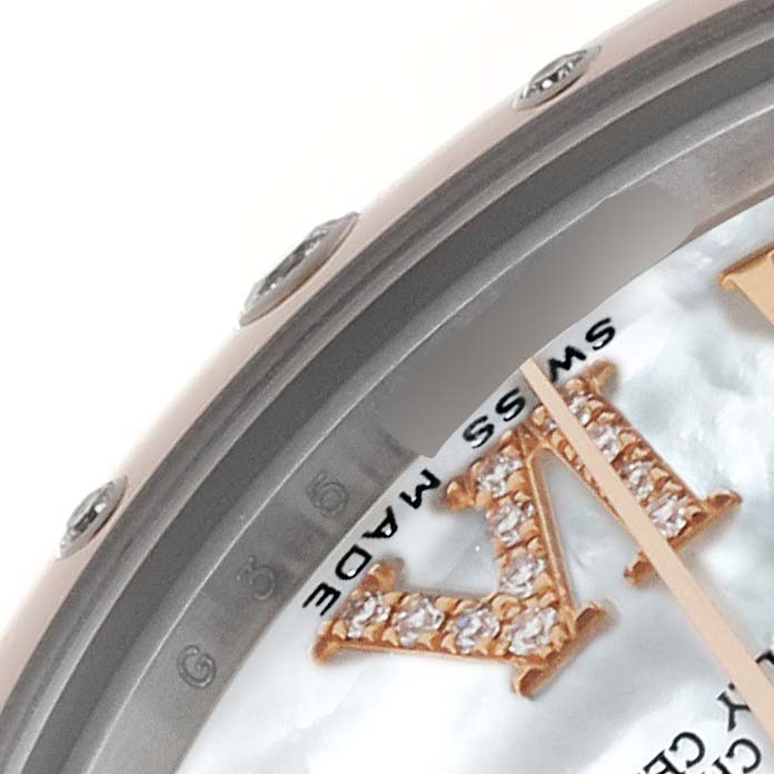This image shows a close-up of the Rolex Mid-Size 178341 Women's Steel and Gold (two tone) Mother of Pearl Dial 178341 Women's Steel and Gold (two tone) Mother of Pearl Dial model, highlighting part of the bezel, dial, and jeweled markers.