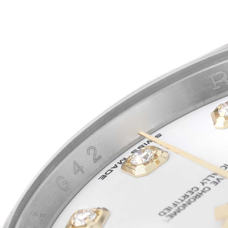 The image shows a close-up of a Rolex Datejust 116233 Men's Steel and Gold (two tone) White Dial watch face, highlighting diamond hour markers and part of the bezel engraving.