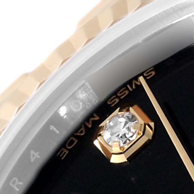The image shows a close-up of the dial, a diamond marker, and part of the bezel and band of a Rolex Mid-Size 178273 Women's Steel and Gold (two tone) Black Dial 178273 Women's Steel and Gold (two tone) Black Dial model watch.