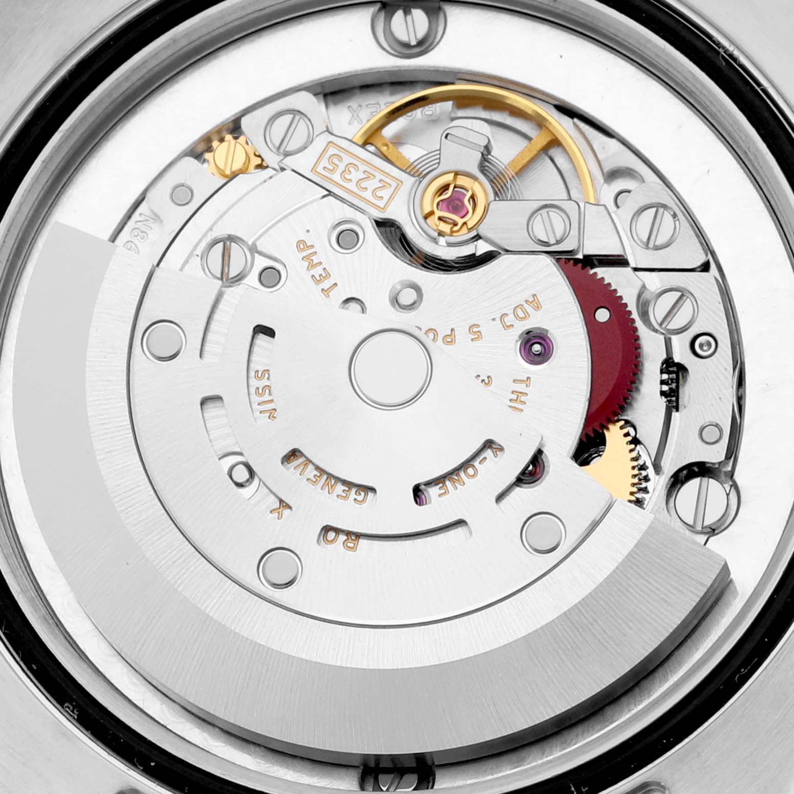 This image showcases the movement and internal mechanisms of a mid-size Rolex watch viewed from the back.