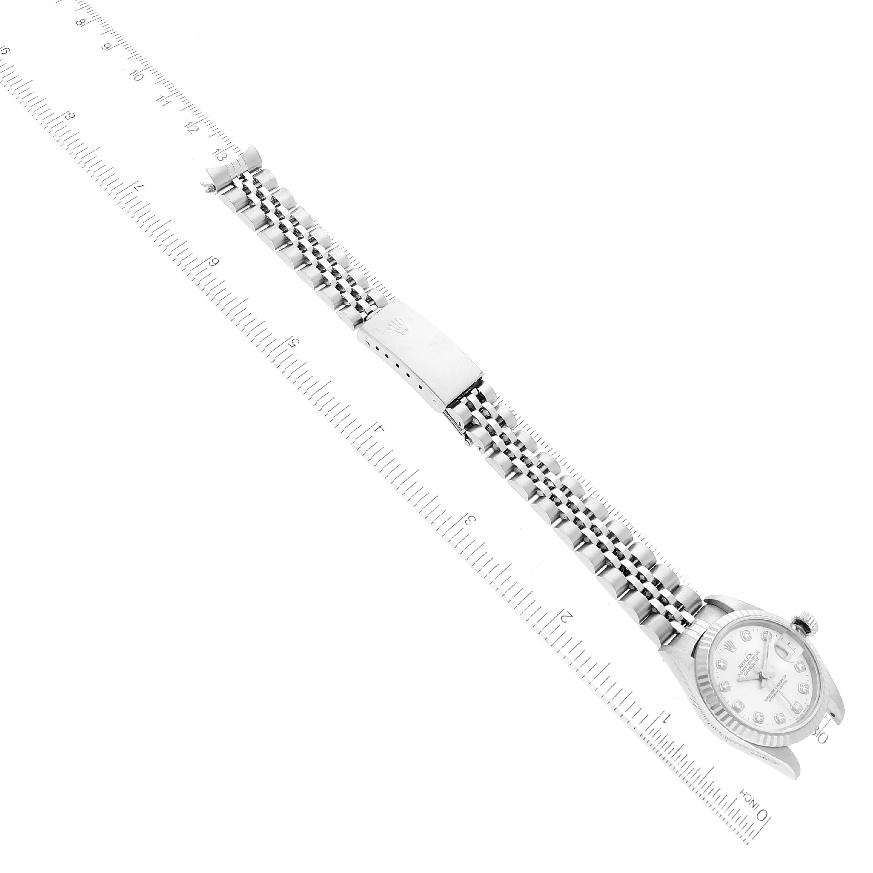 The Rolex Datejust 69174 Women's Stainless Steel Silver Dial 69174 Women's Stainless Steel Silver Dial watch is shown lying flat, displaying its face, band, and clasp.