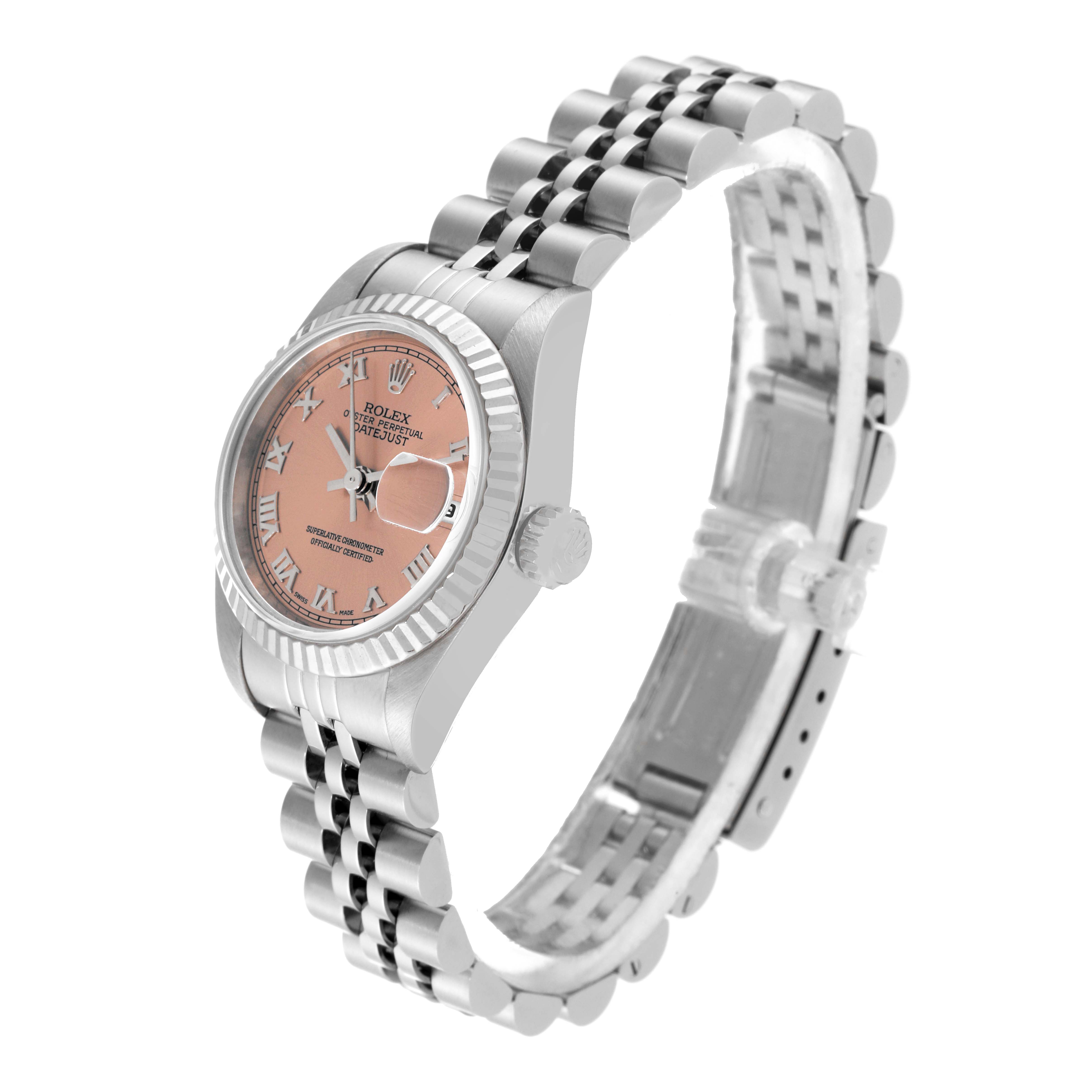 The Rolex Datejust 69174 Women's Stainless Steel Pink Dial 69174 Women's Stainless Steel Pink Dial watch is shown at an angled side view displaying its face, bezel, crown, and bracelet.