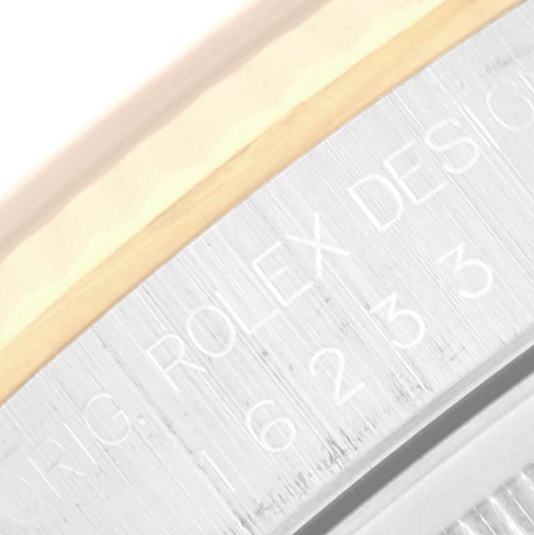 The image shows a close-up angle of the case back and bezel area of a Rolex Datejust 16233 Men's Steel and Gold (two tone) Black Dial 16233 Men's Steel and Gold (two tone) Black Dial watch.
