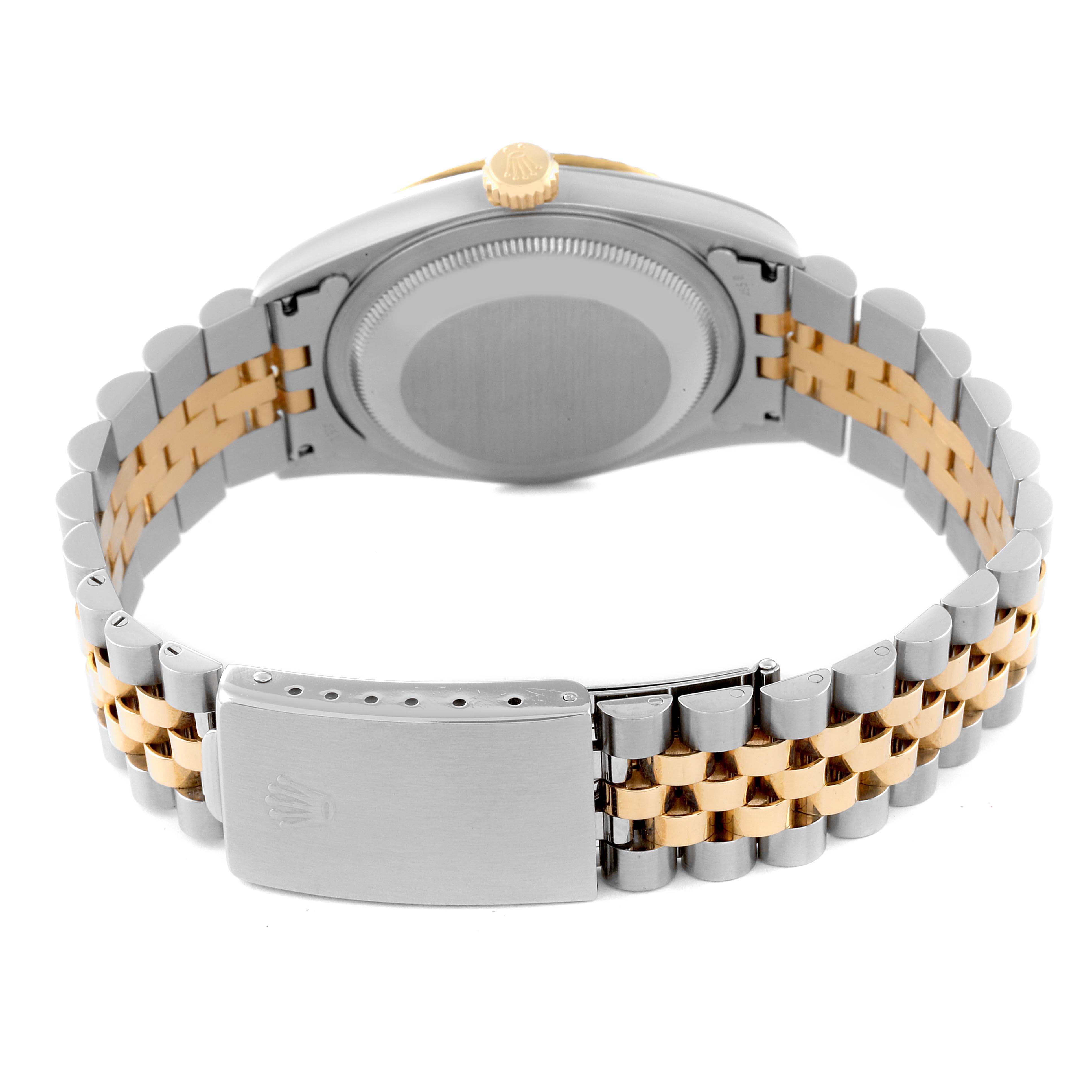 The image shows the back view of a Rolex Datejust 16233 Men's Steel and Gold (two tone) Black Dial 16233 Men's Steel and Gold (two tone) Black Dial watch, highlighting its two-tone bracelet and closed case back.