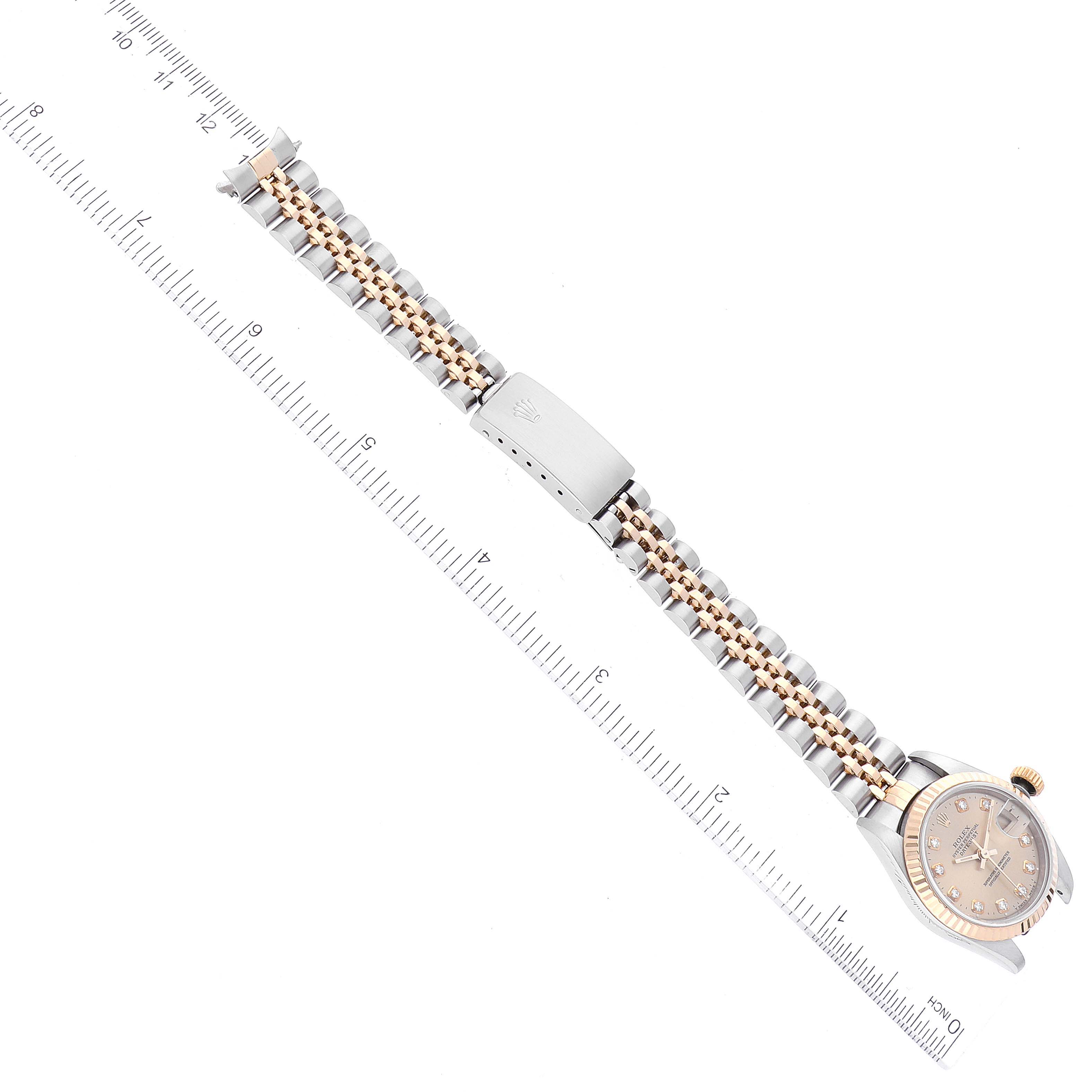 The image shows a top view of a Rolex Datejust 69173 Women's Steel and Gold (two tone) Champagne Dial 69173 Women's Steel and Gold (two tone) Champagne Dial watch, showcasing its metal bracelet and part of the watch face.