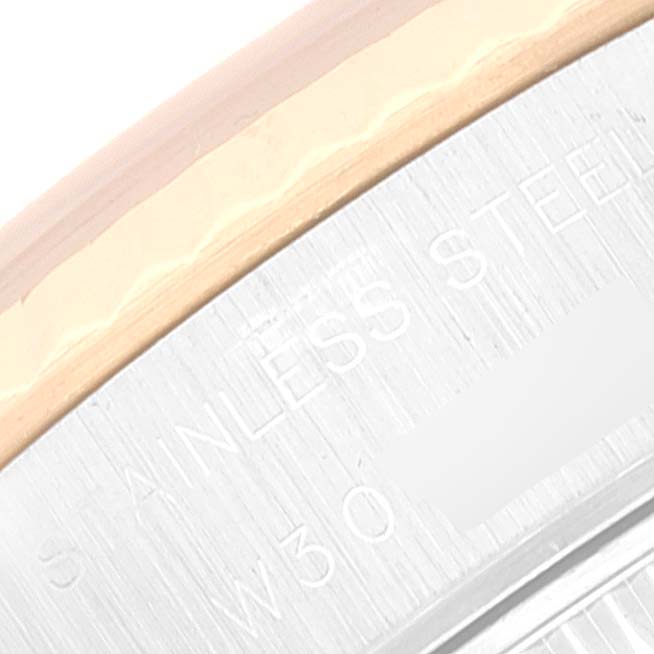 The image shows a close-up of the bezel and part of the stainless steel case back of a Rolex Datejust 69173 Women's Steel and Gold (two tone) Champagne Dial 69173 Women's Steel and Gold (two tone) Champagne Dial watch.