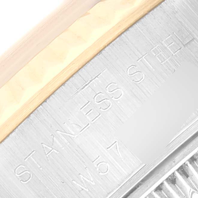 The image shows a close-up of the side of a Rolex Datejust 69173 Women's Steel and Gold (two tone) Champagne Dial 69173 Women's Steel and Gold (two tone) Champagne Dial watch with "STAINLESS STEEL" engraved.