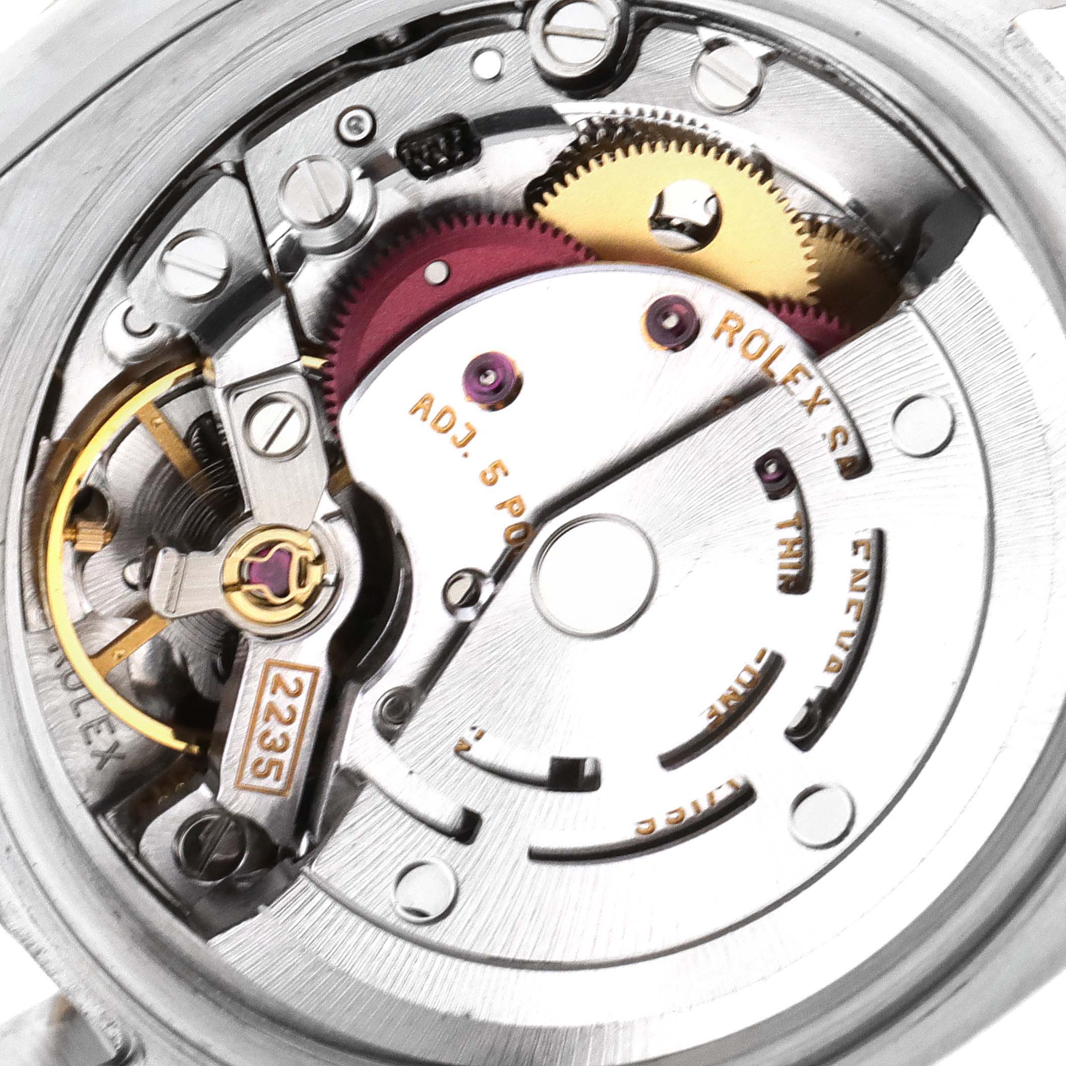 The image shows the internal mechanism of a Rolex Datejust 179173 Women's Steel and Gold (two tone) Mother of Pearl Dial 179173 Women's Steel and Gold (two tone) Mother of Pearl Dial watch taken from a top-down angle, highlighting gears and components.