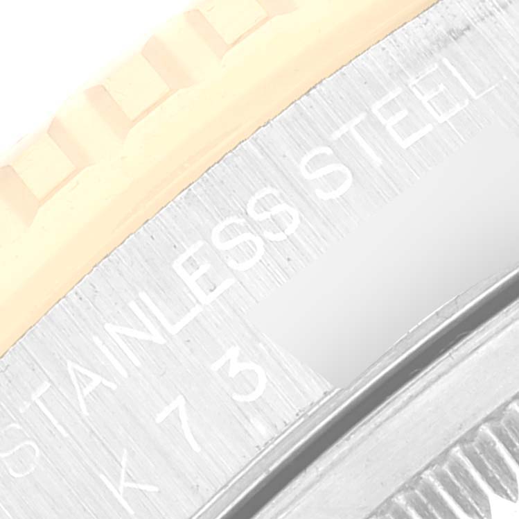 The image shows a close-up of the bezel and casing of a Rolex Turn-o-Graph 16263 Men's Steel and Gold (two tone) White Dial 16263 Men's Steel and Gold (two tone) White Dial watch, highlighting the "STAINLESS STEEL" inscription.