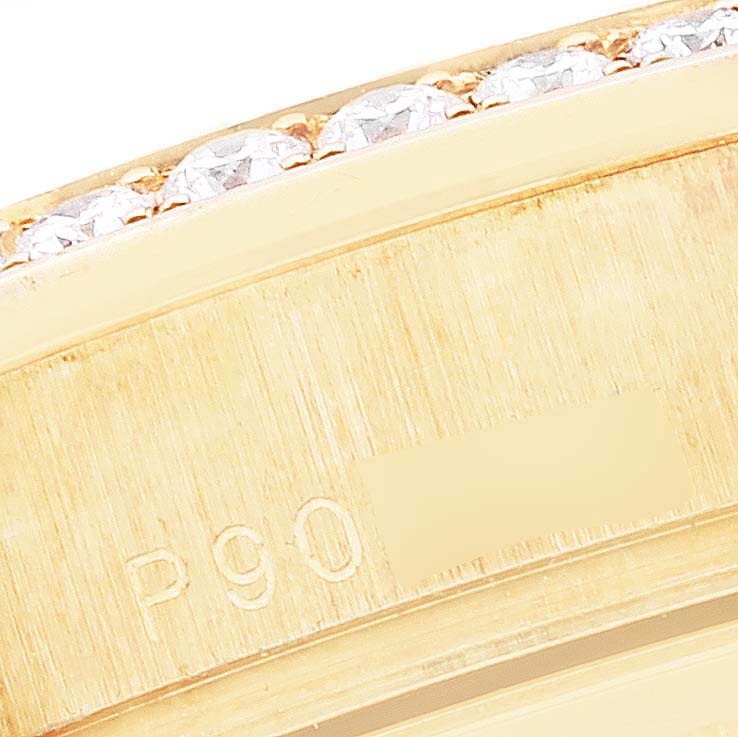The image shows a close-up of the bezel and engraving on a Rolex President 118348 Men's Yellow Gold Mother of Pearl Dial 118348 Men's Yellow Gold Mother of Pearl Dial model watch.