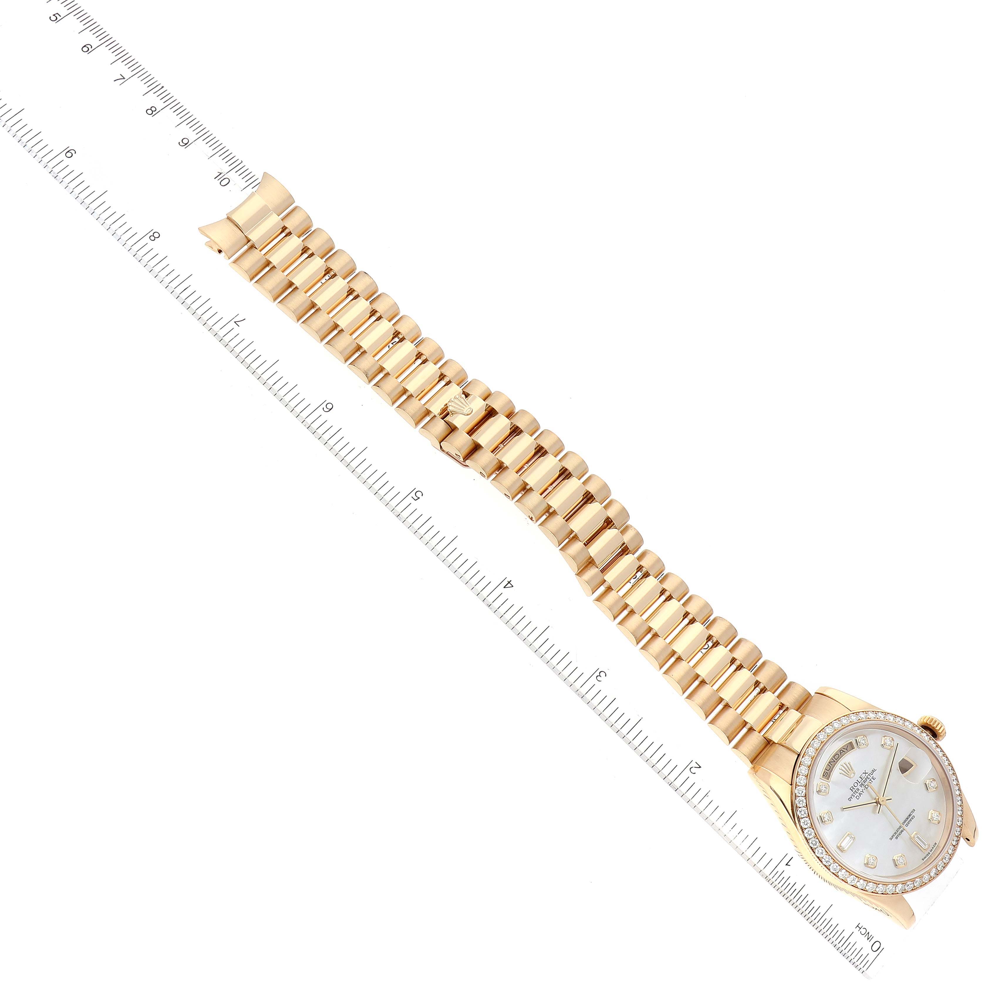 The Rolex President 118348 Men's Yellow Gold Mother of Pearl Dial 118348 Men's Yellow Gold Mother of Pearl Dial model watch is shown from a top-down angle, displaying its face, bezel, bracelet, and a ruler for scale.