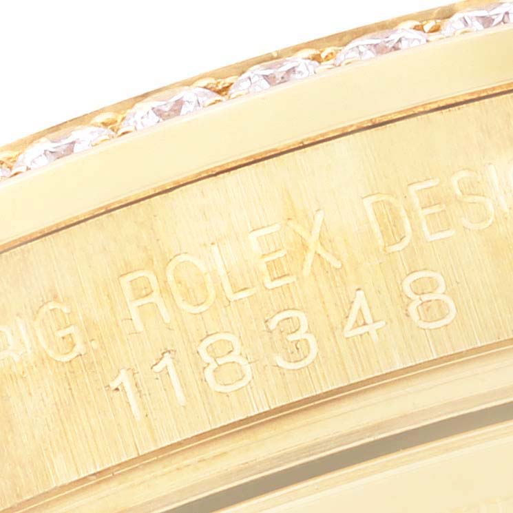 This close-up angle shows the engraved model number and part of the diamond-encrusted bezel of the Rolex President 118348 Men's Yellow Gold Mother of Pearl Dial 118348 Men's Yellow Gold Mother of Pearl Dial watch.