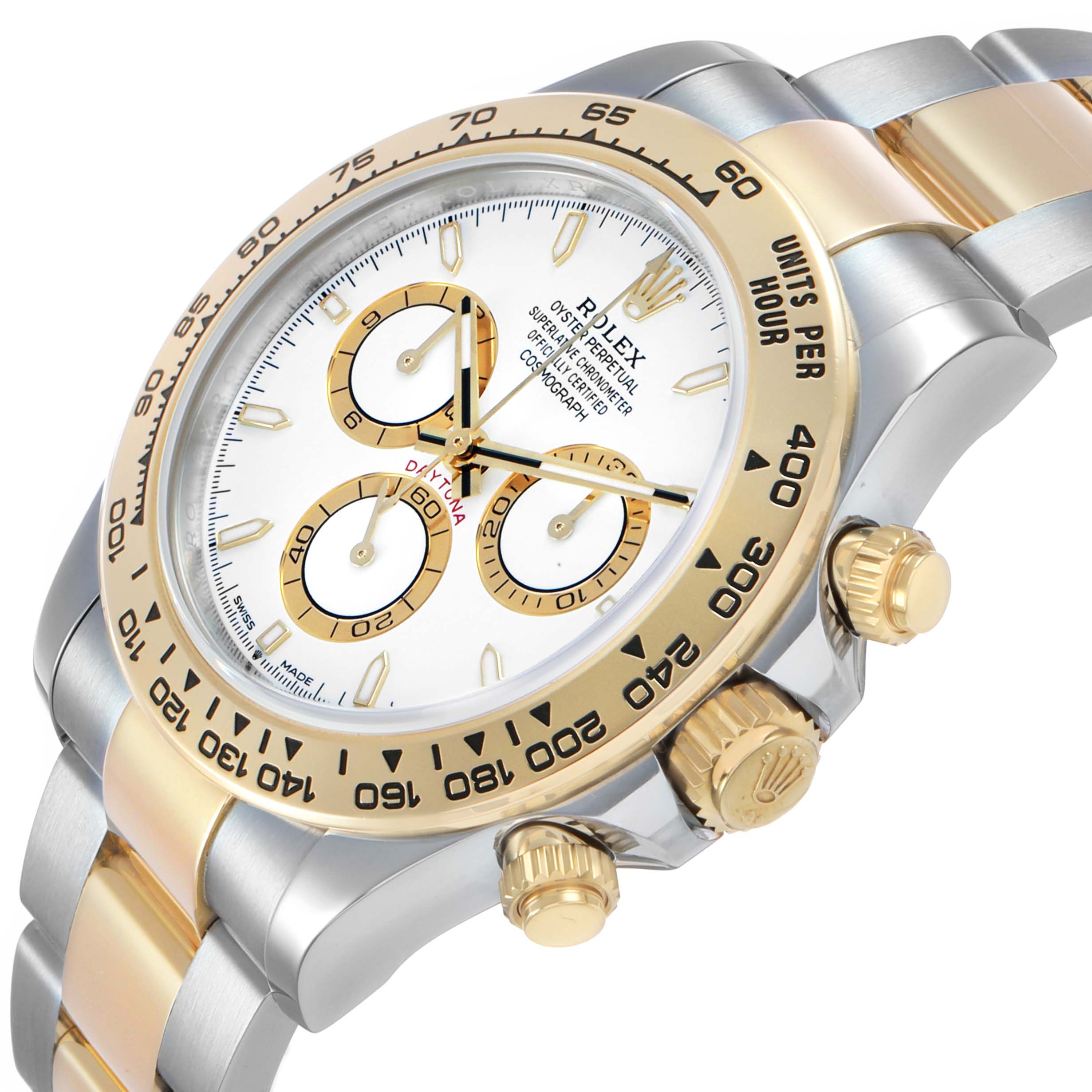 The Rolex Daytona M126503-0001 Men's Steel and Gold (two tone) White Dial watch is shown at an angled view, highlighting the bezel, crown, pushers, dial, and part of the bracelet.