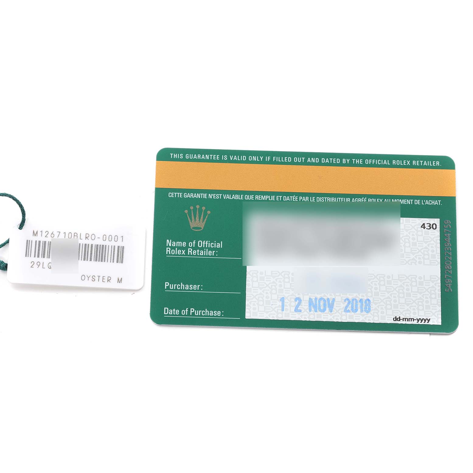 The image shows a warranty card and hangtag for a Rolex GMT-Master 126710BLRO Men
s Stainless Steel Black Dial 126710BLRO Men
s Stainless Steel Black Dial model.