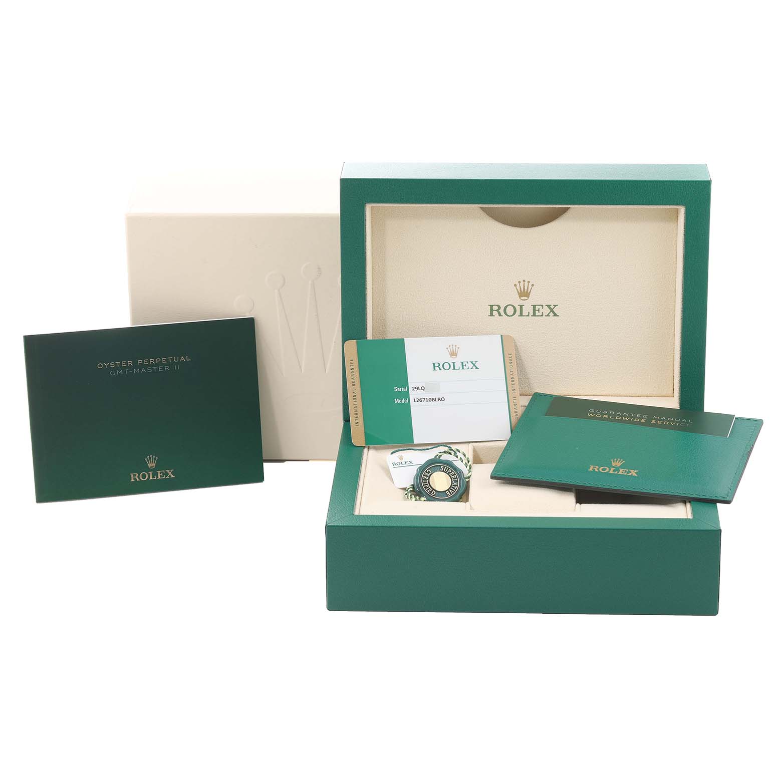 The image shows complete packaging accessories for a Rolex GMT-Master 126710BLRO Men
s Stainless Steel Black Dial 126710BLRO Men
s Stainless Steel Black Dial, including the box, warranty card, booklet, and tag.