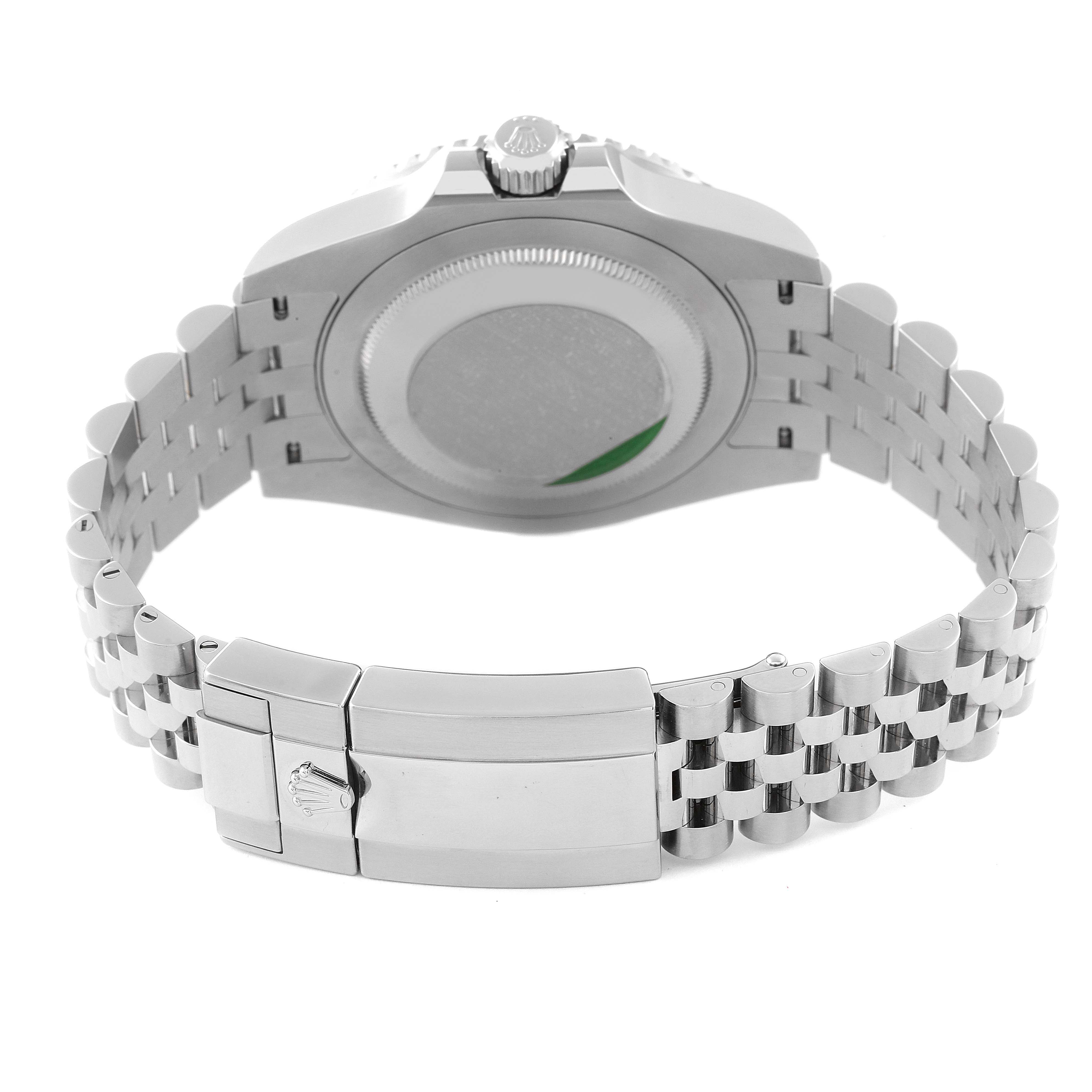 The Rolex GMT-Master 126710BLRO Men
s Stainless Steel Black Dial 126710BLRO Men
s Stainless Steel Black Dial watch is shown from the back, highlighting the case back, crown, and stainless steel bracelet with the clasp open.