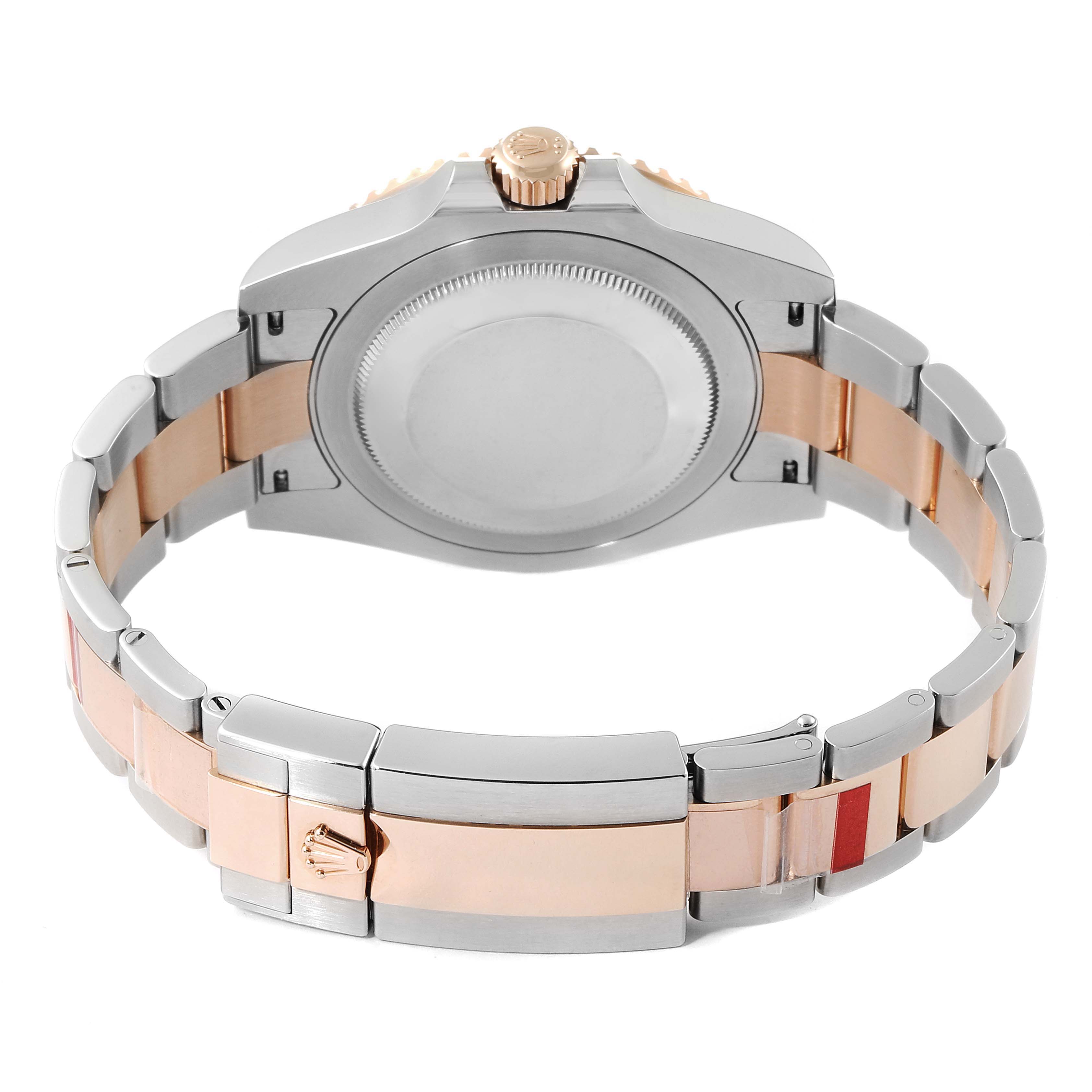 This image shows the back case and bracelet of the Rolex GMT-Master 126711CHNR Men's Steel and Gold (two tone) Black Dial 126711CHNR Men's Steel and Gold (two tone) Black Dial watch from a rear angle.